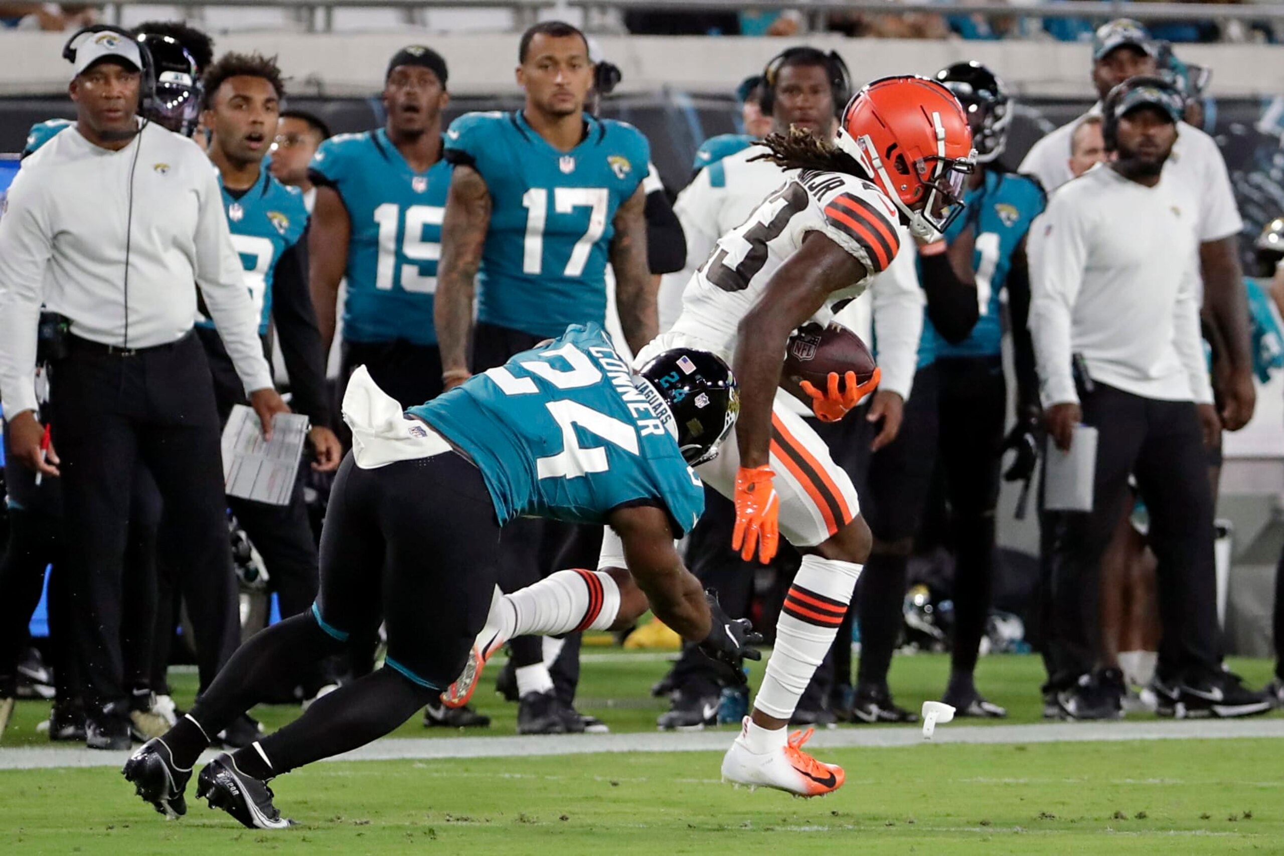 Cleveland Browns cornerback Martin Emerson Jr., right, runs past Jacksonville Jaguars running back Snoop Conner (24) after intercepting a pass during the second half of an NFL preseason football game, Friday, Aug. 12, 2022, in Jacksonville, Fla. (AP Photo/Stephen B. Morton) Cleveland Browns cornerback Martin Emerson Jr., right, runs past Jacksonville Jaguars running back Snoop Conner (24) after intercepting a pass during the second half of an NFL preseason football game, Friday, Aug. 12, 2022, in Jacksonville, Fla. (AP Photo/Stephen B. Morton)