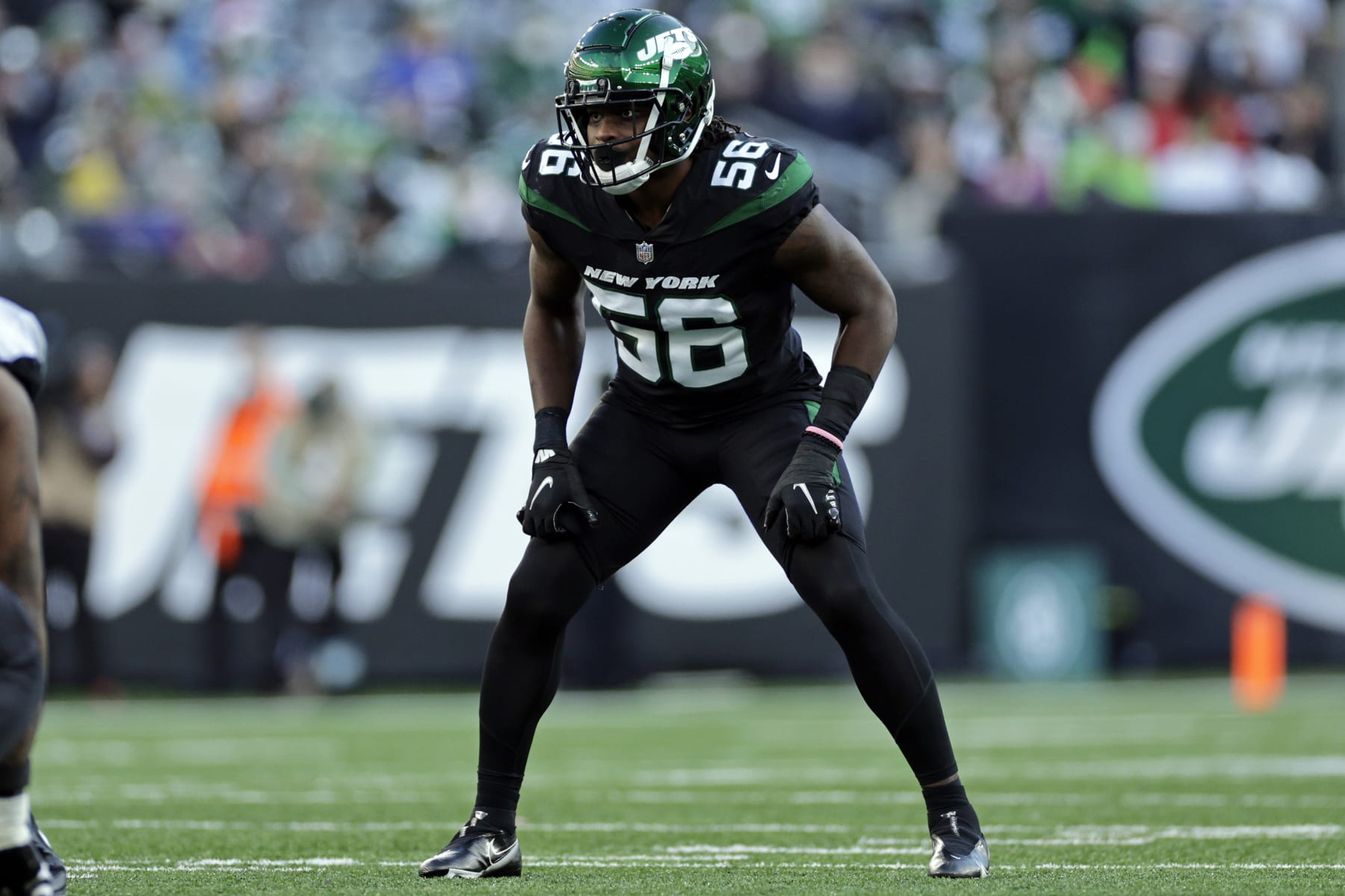 New York Jets outside linebacker Quincy Williams (56) defends against the Jacksonville Jaguars during an NFL football game, Sunday, Dec. 26, 2021, in East Rutherford, N.J. (AP Photo/Adam Hunger)