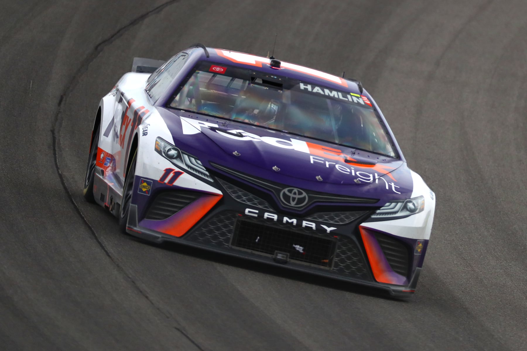 BROOKLYN, MICHIGAN - AUGUST 07: Denny Hamlin, driver of the #11 FedEx Freight Toyota, drives during the NASCAR Cup Series FireKeepers Casino 400 at Michigan International Speedway on August 07, 2022 in Brooklyn, Michigan. (Photo by Mike Mulholland/Getty Images)