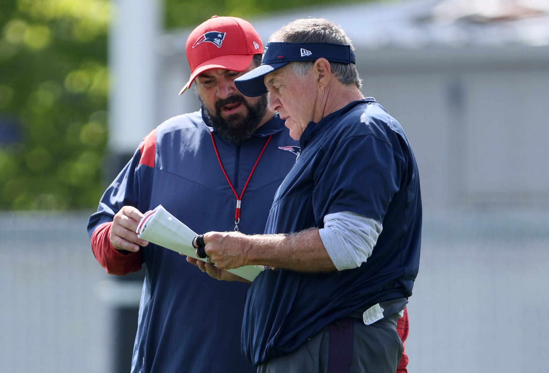 Foxborough, MA - August 1: Matt Patricia, Senior Football Advisor/Offensive Line coach talks to Patriots head coach Bill Belichick during Patriots Training Camp. (Photo by Jessica Rinaldi/The Boston Globe via Getty Images)