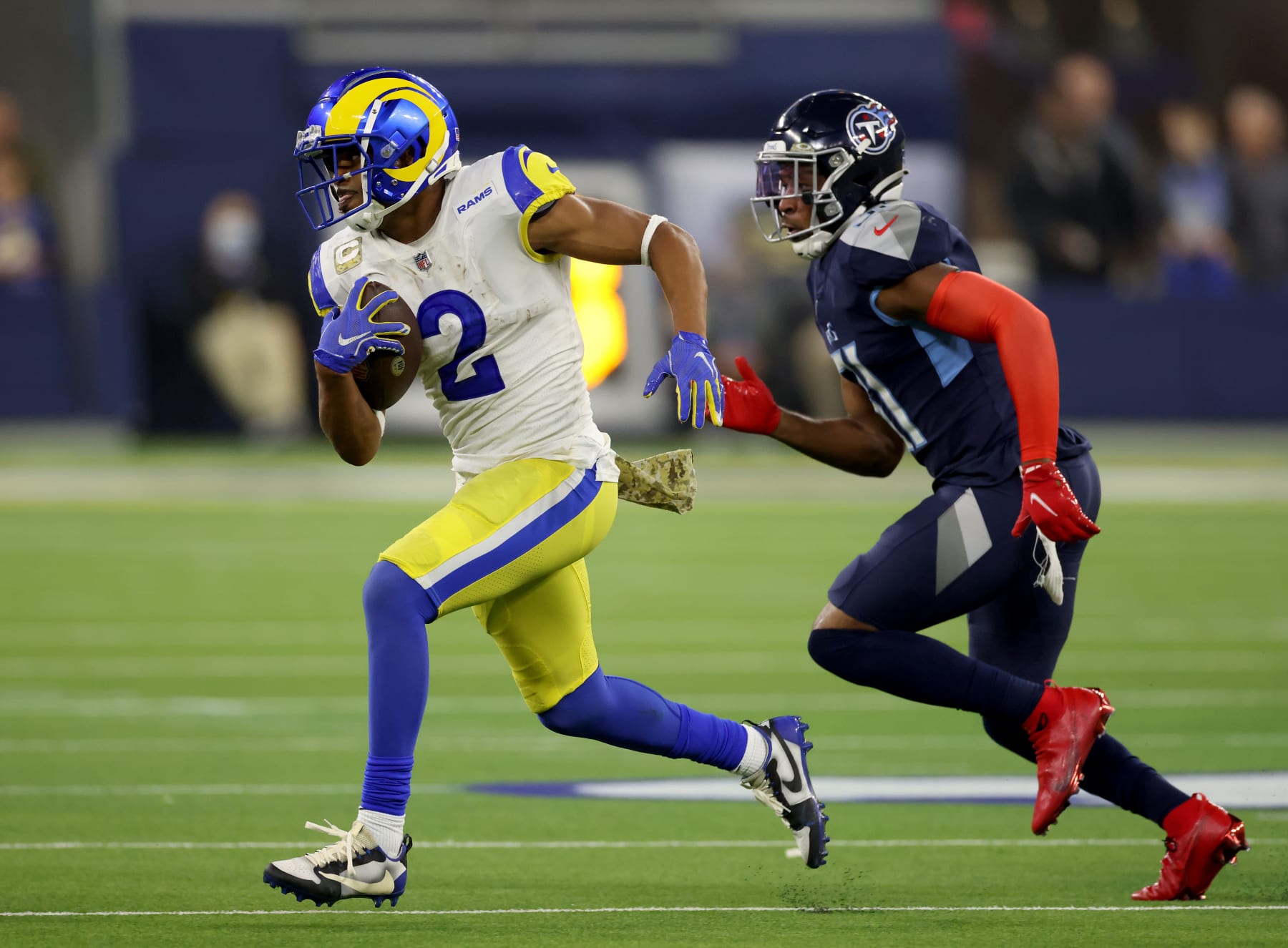 INGLEWOOD, CALIFORNIA - NOVEMBER 07: Robert Woods #2 of the Los Angeles Rams is chased by Kevin Byard #31 of the Tennessee Titans after his catch during a 28-16 loss to the Tennessee Titans at SoFi Stadium on November 07, 2021 in Inglewood, California. (Photo by Harry How/Getty Images)