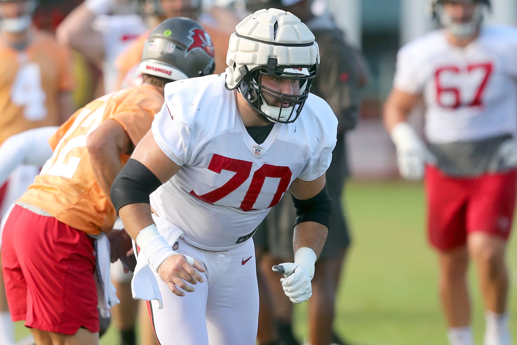 TAMPA, FL - AUG 09: Tampa Bay Buccaneers center Robert Hainsey (70) goes thru a drill during the Tampa Bay Buccaneers Training Camp on August 09, 2022 at the AdventHealth Training Center at One Buccaneer Place in Tampa, Florida. (Photo by Cliff Welch/Icon Sportswire via Getty Images)