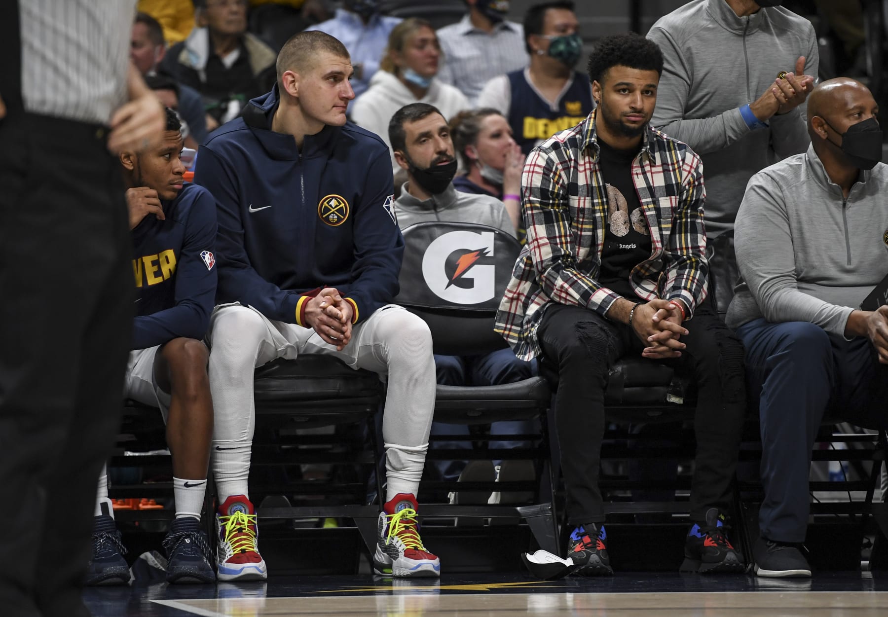 DENVER, CO - OCTOBER 25: Nikola Jokic (15) and Jamal Murray (27) of the Denver Nuggets watch the bench play the final minutes against the Cleveland Cavaliers during the fourth quarter of Cleveland"u2019s 99-87 win on Monday, October 25, 2021. (Photo by AAron Ontiveroz/MediaNews Group/The Denver Post via Getty Images)