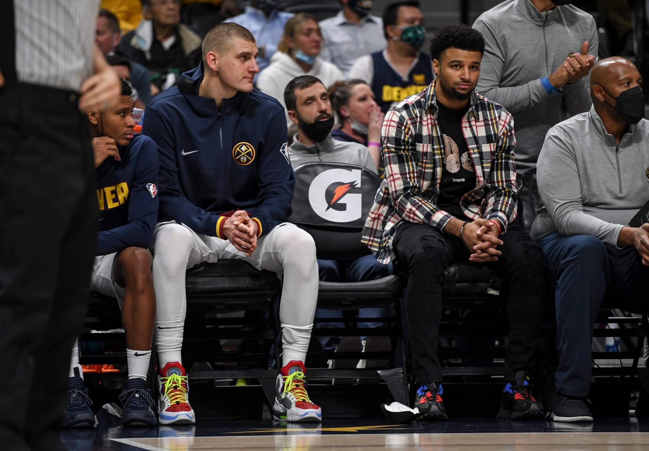 DENVER, CO - OCTOBER 25: Nikola Jokic (15) and Jamal Murray (27) of the Denver Nuggets watch the bench play the final minutes against the Cleveland Cavaliers during the fourth quarter of Cleveland"u2019s 99-87 win on Monday, October 25, 2021. (Photo by AAron Ontiveroz/MediaNews Group/The Denver Post via Getty Images)
