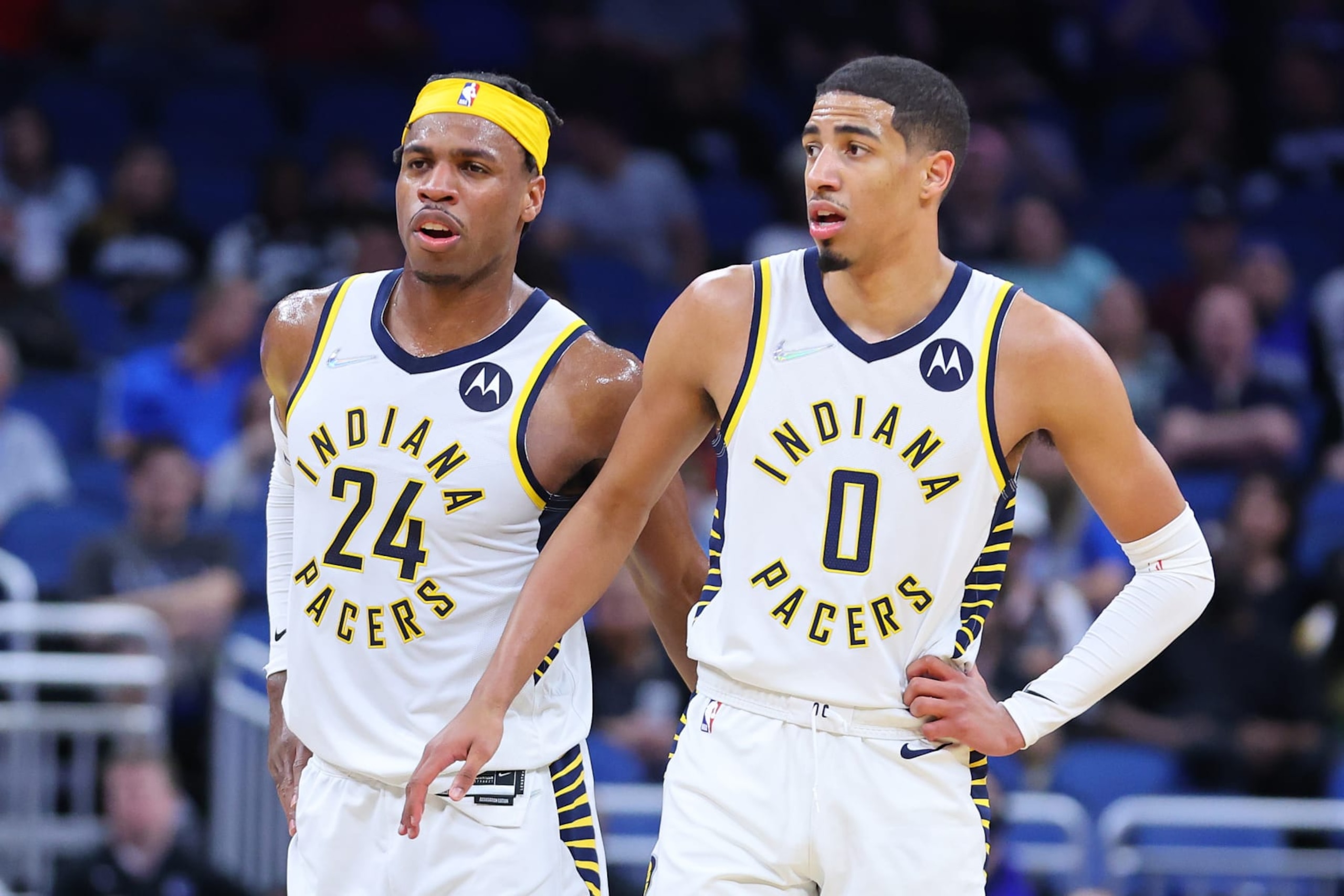 ORLANDO, FLORIDA - MARCH 02: Buddy Hield #24 and Tyrese Haliburton #0 of the Indiana Pacers look on against the Orlando Magic during the first half at Amway Center on March 02, 2022 in Orlando, Florida. NOTE TO USER: User expressly acknowledges and agrees that, by downloading and or using this photograph, User is consenting to the terms and conditions of the Getty Images License Agreement.  (Photo by Michael Reaves/Getty Images)