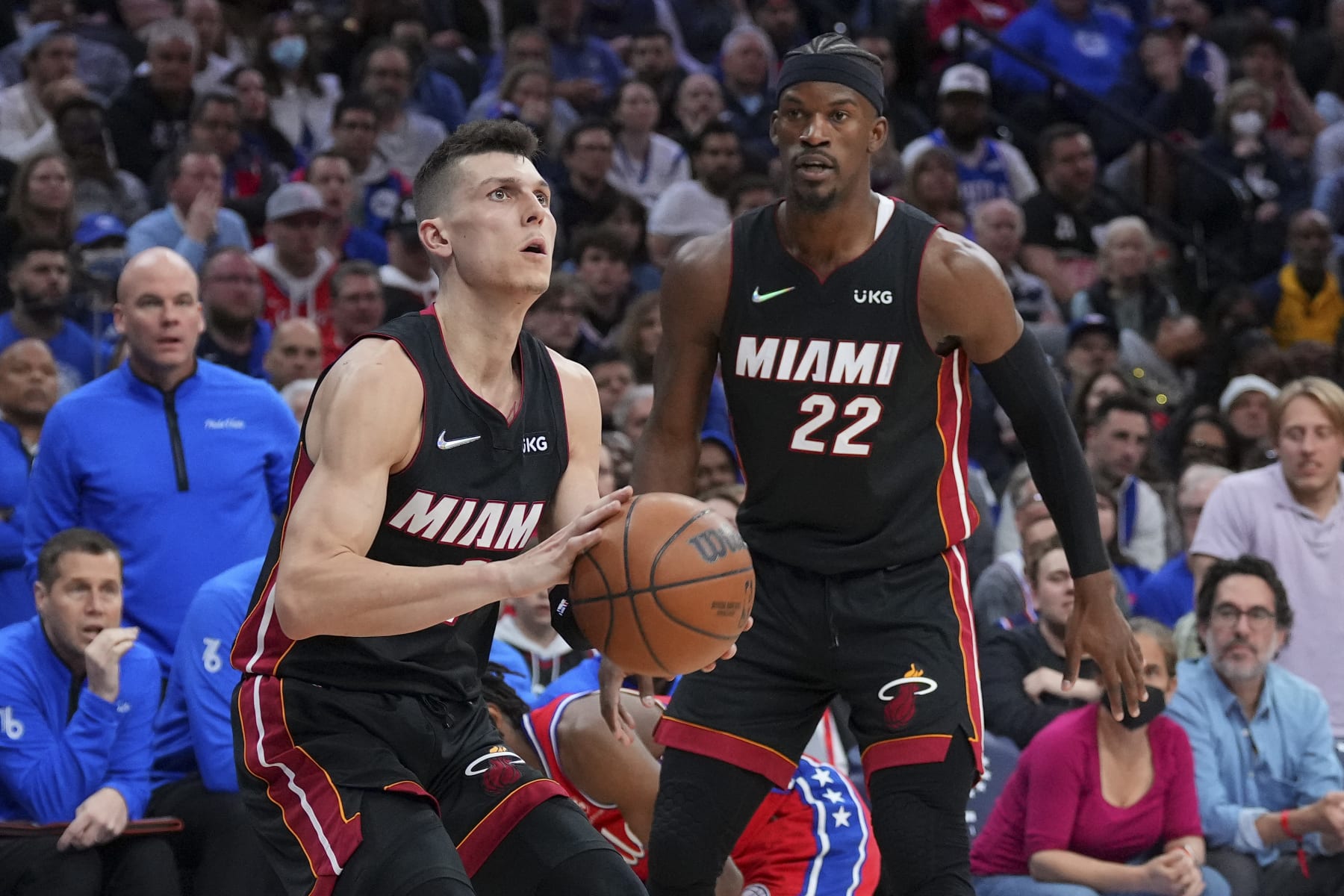 PHILADELPHIA, PA - MAY 08: Tyler Herro #14 of the Miami Heat shoots the ball as Jimmy Butler #22 looks on against the Philadelphia 76ers during Game Four of the 2022 NBA Playoffs Eastern Conference Semifinals at the Wells Fargo Center on May 8, 2022 in Philadelphia, Pennsylvania. The 76ers defeated the Heat 116-108. NOTE TO USER: User expressly acknowledges and agrees that, by downloading and or using this photograph, User is consenting to the terms and conditions of the Getty Images License Agreement. (Photo by Mitchell Leff/Getty Images)