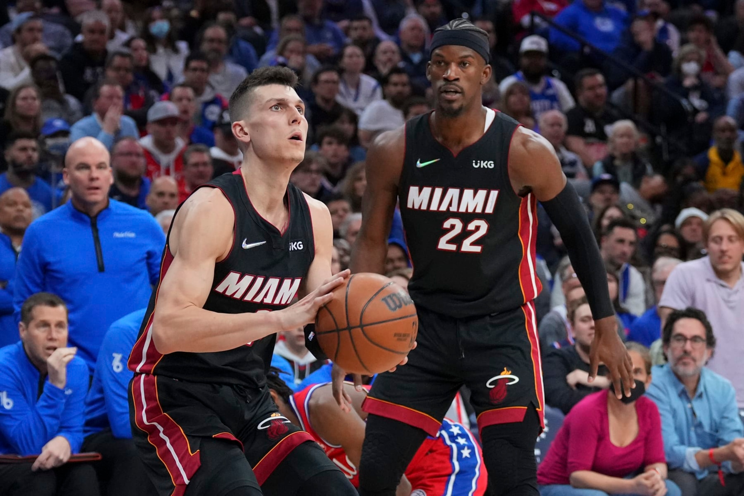 PHILADELPHIA, PA - MAY 08: Tyler Herro #14 of the Miami Heat shoots the ball as Jimmy Butler #22 looks on against the Philadelphia 76ers during Game Four of the 2022 NBA Playoffs Eastern Conference Semifinals at the Wells Fargo Center on May 8, 2022 in Philadelphia, Pennsylvania. The 76ers defeated the Heat 116-108. NOTE TO USER: User expressly acknowledges and agrees that, by downloading and or using this photograph, User is consenting to the terms and conditions of the Getty Images License Agreement. (Photo by Mitchell Leff/Getty Images)