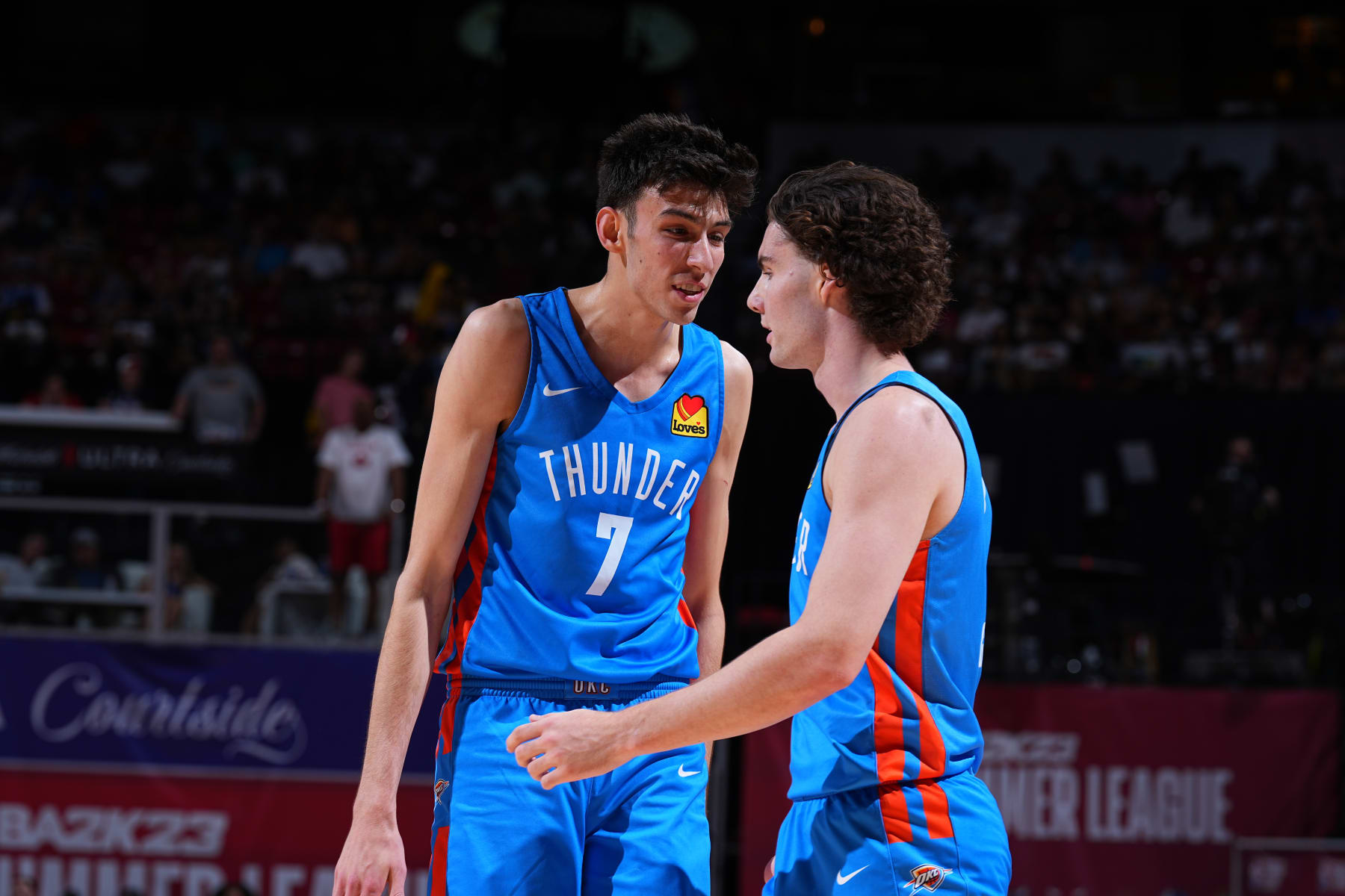 LAS VEGAS, NV - JULY 9:  Chet Holmgren #7 and Josh Giddey #3 of the Oklahoma City Thunder talk against the Houston Rockets during the 2022 Las Vegas Summer League on July 9, 2022 at the Thomas & Mack Center in Las Vegas, Nevada NOTE TO USER: User expressly acknowledges and agrees that, by downloading and/or using this Photograph, user is consenting to the terms and conditions of the Getty Images License Agreement. Mandatory Copyright Notice: Copyright 2022 NBAE (Photo by Garrett Ellwood/NBAE via Getty Images)