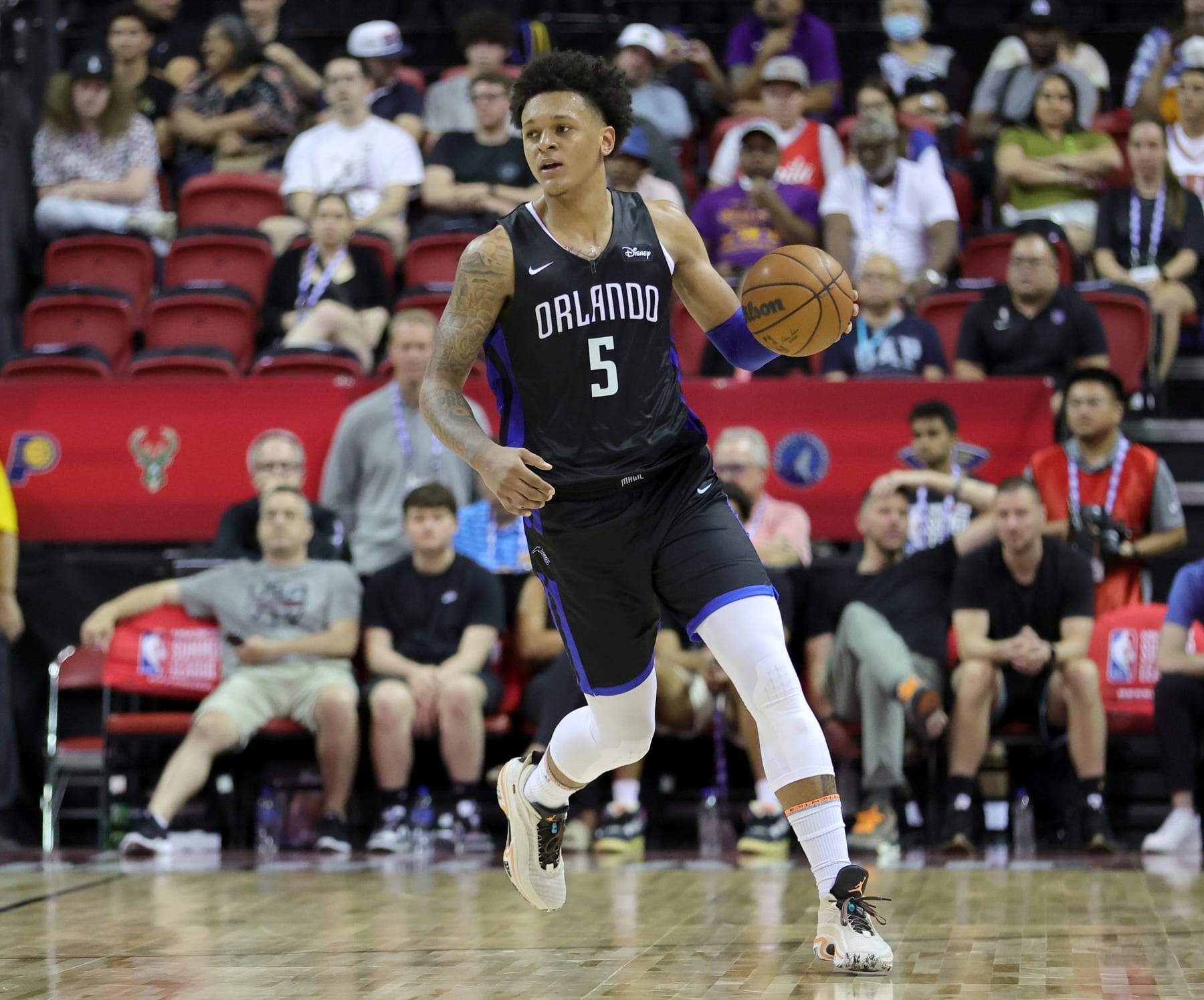 LAS VEGAS, NEVADA - JULY 09: Paolo Banchero #5 of the Orlando Magic brings the ball up the court against the Sacramento Kings during the 2022 NBA Summer League at the Thomas & Mack Center on July 09, 2022 in Las Vegas, Nevada. NOTE TO USER: User expressly acknowledges and agrees that, by downloading and or using this photograph, User is consenting to the terms and conditions of the Getty Images License Agreement. (Photo by Ethan Miller/Getty Images)