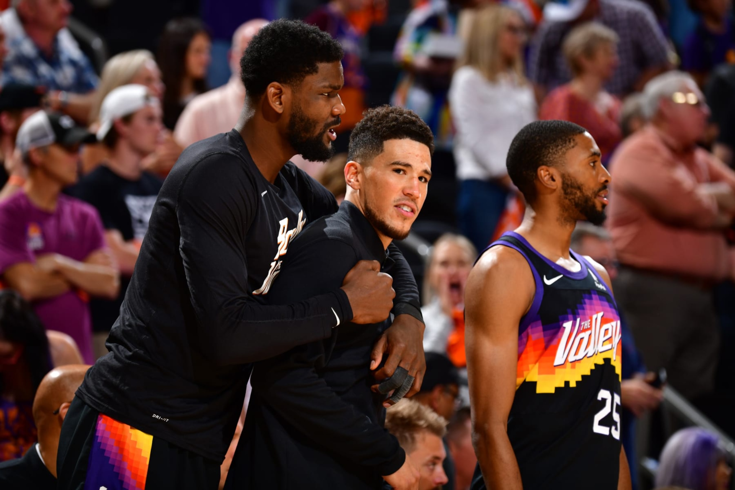 PHOENIX, AZ - MAY 4: Deandre Ayton #22 and Devin Booker #1 of the Phoenix Suns embrace during Game 2 of the 2022 NBA Playoffs Western Conference Semifinals on May 4, 2022 at Footprint Center in Phoenix, Arizona. NOTE TO USER: User expressly acknowledges and agrees that, by downloading and or using this photograph, user is consenting to the terms and conditions of the Getty Images License Agreement. Mandatory Copyright Notice: Copyright 2022 NBAE (Photo by Barry Gossage/NBAE via Getty Images)