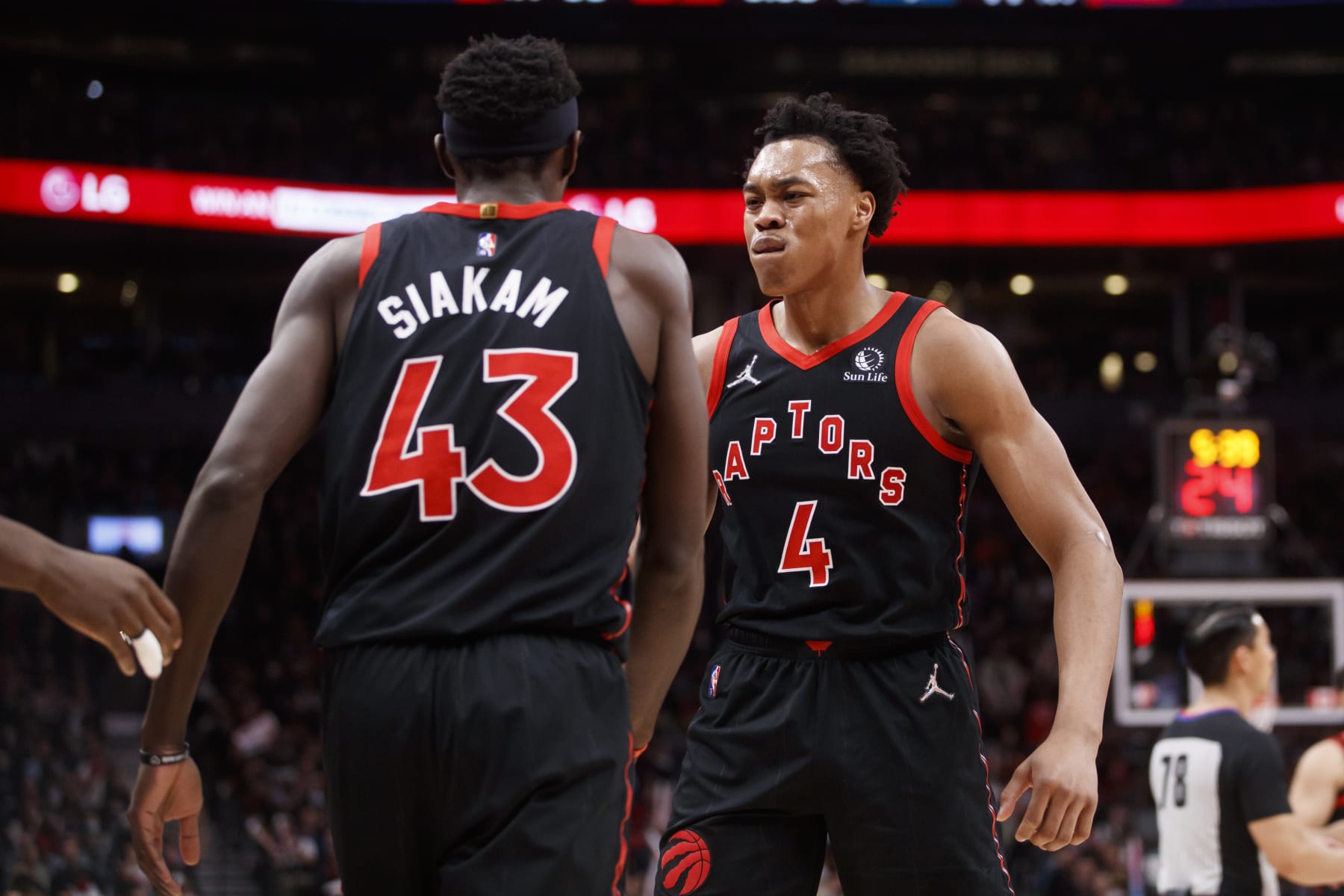 TORONTO, ON - MARCH 28: Scottie Barnes #4 of the Toronto Raptors and Pascal Siakam #43 celebrate during the first half of their NBA game against the Boston Celtics at Scotiabank Arena on March 28, 2022 in Toronto, Canada. NOTE TO USER: User expressly acknowledges and agrees that, by downloading and or using this Photograph, user is consenting to the terms and conditions of the Getty Images License Agreement. (Photo by Cole Burston/Getty Images)