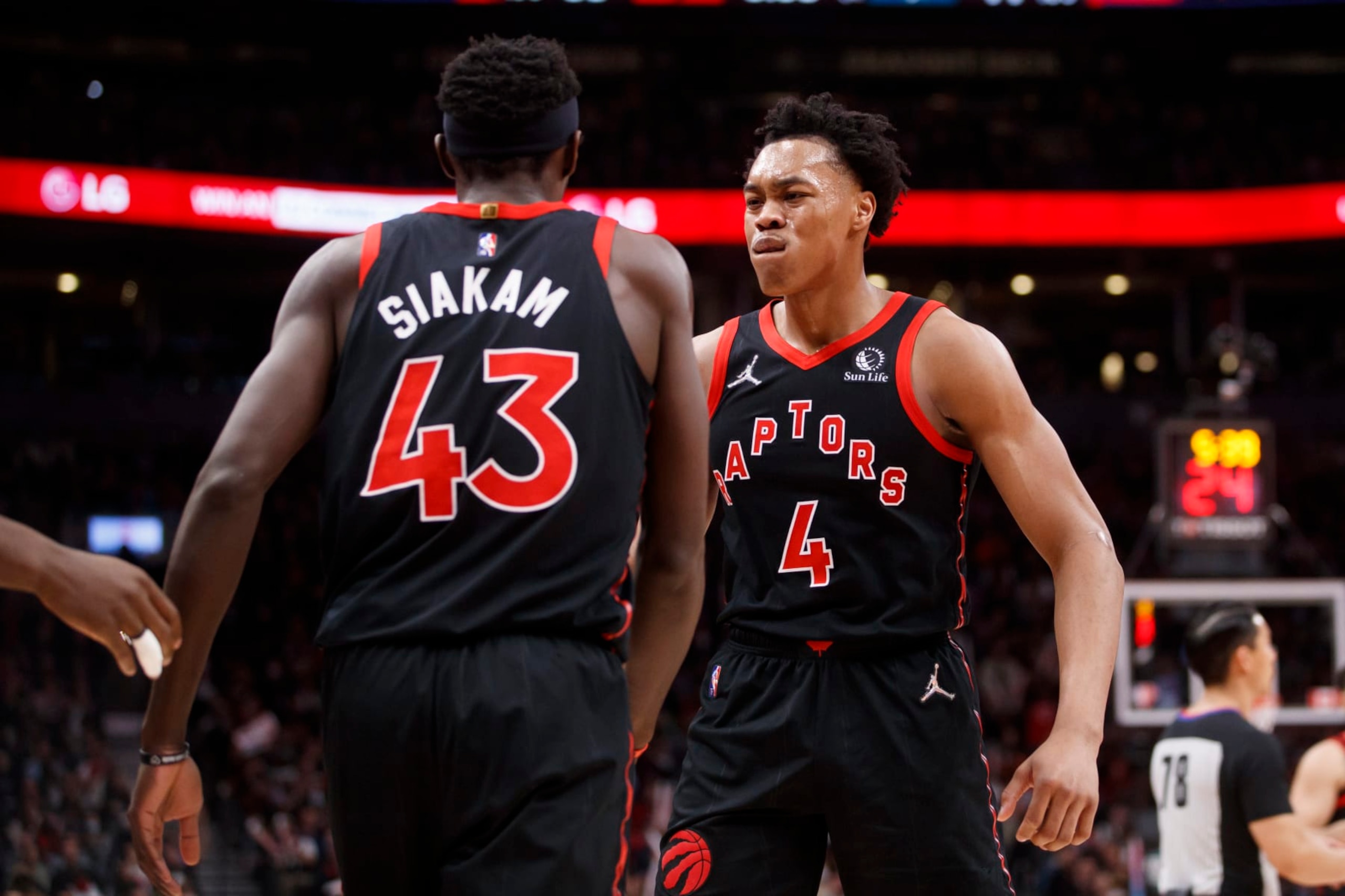 TORONTO, ON - MARCH 28: Scottie Barnes #4 of the Toronto Raptors and Pascal Siakam #43 celebrate during the first half of their NBA game against the Boston Celtics at Scotiabank Arena on March 28, 2022 in Toronto, Canada. NOTE TO USER: User expressly acknowledges and agrees that, by downloading and or using this Photograph, user is consenting to the terms and conditions of the Getty Images License Agreement. (Photo by Cole Burston/Getty Images)