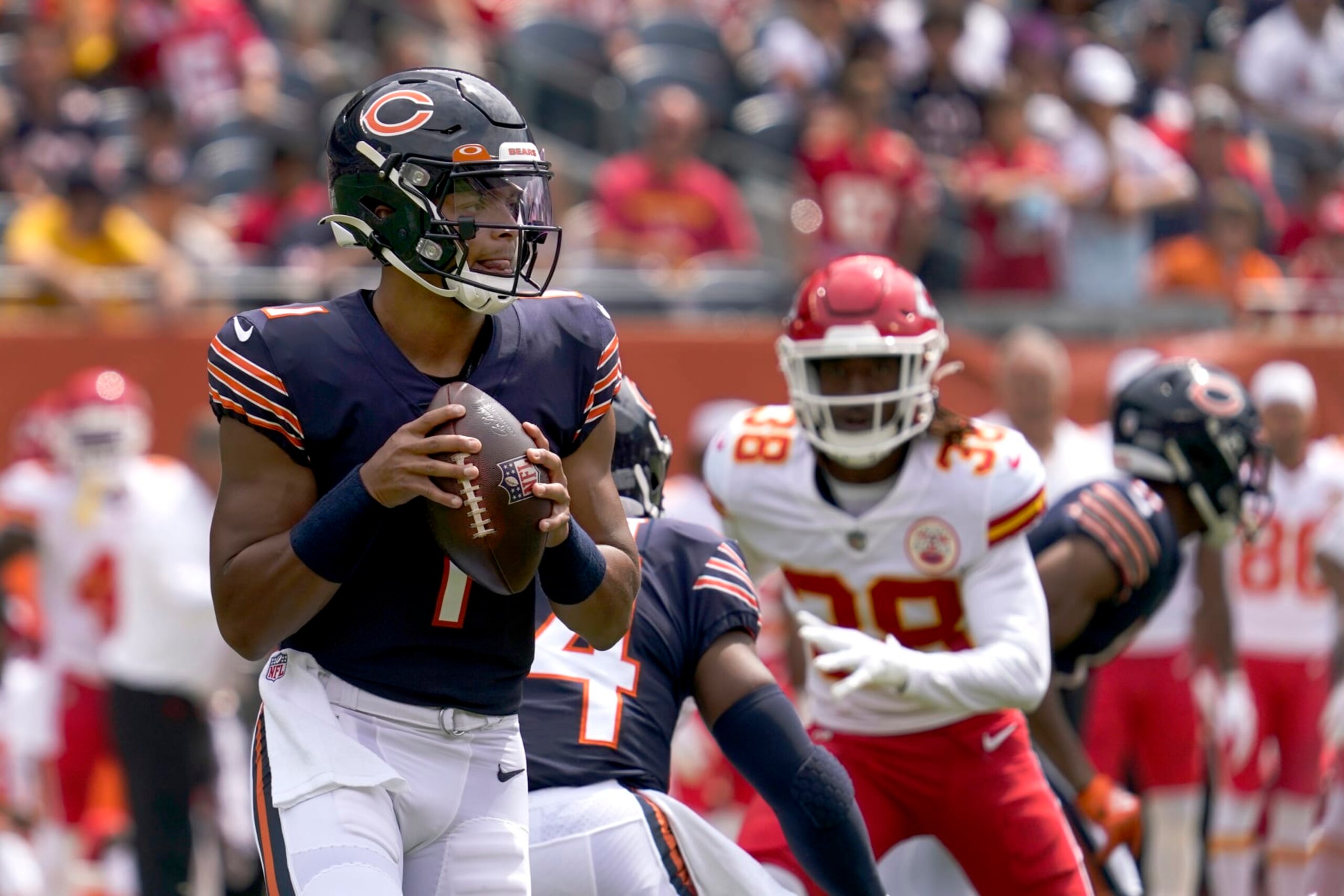 Chicago Bears quarterback Justin Fields drops back to pass during the first half of an NFL preseason football game against the Kansas City Chiefs Saturday, Aug. 13, 2022, in Chicago. (AP Photo/Nam Y. Huh)