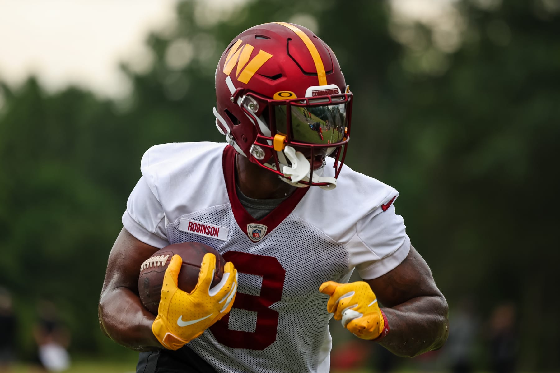 ASHBURN, VA - JUNE 14: Brian Robinson #8 of the Washington Commanders carries the ball during the organized team activity at INOVA Sports Performance Center on June 14, 2022 in Ashburn, Virginia. (Photo by Scott Taetsch/Getty Images) ASHBURN, VA - JUNE 14: Brian Robinson #8 of the Washington Commanders carries the ball during the organized team activity at INOVA Sports Performance Center on June 14, 2022 in Ashburn, Virginia. (Photo by Scott Taetsch/Getty Images)