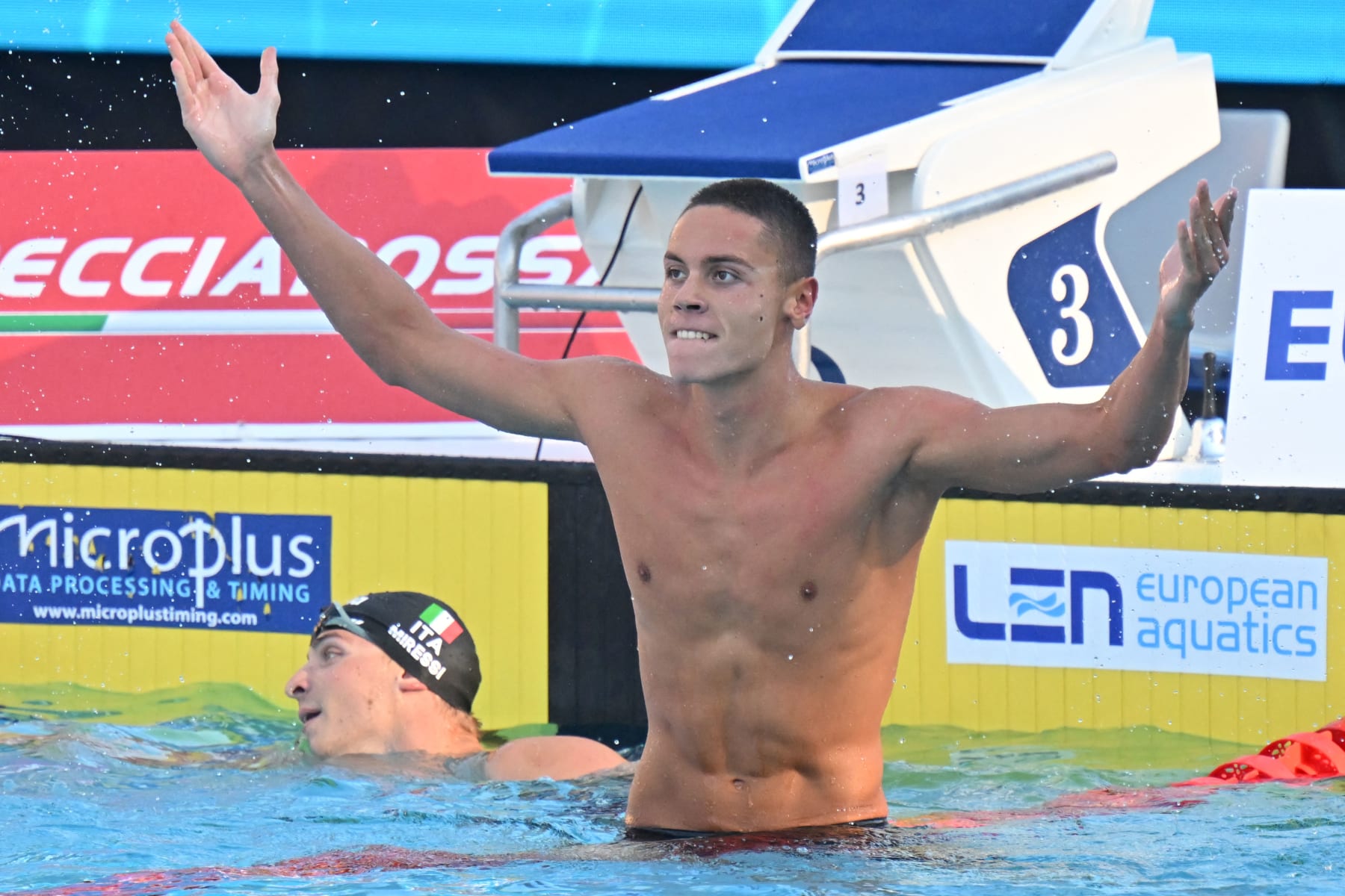 Romania's David Popovici reacts after winning and setting a new world record in the Men's 100m freestyle final event on August 13, 2022 at the LEN European Aquatics Championships in Rome. (Photo by Alberto PIZZOLI / AFP) (Photo by ALBERTO PIZZOLI/AFP via Getty Images)