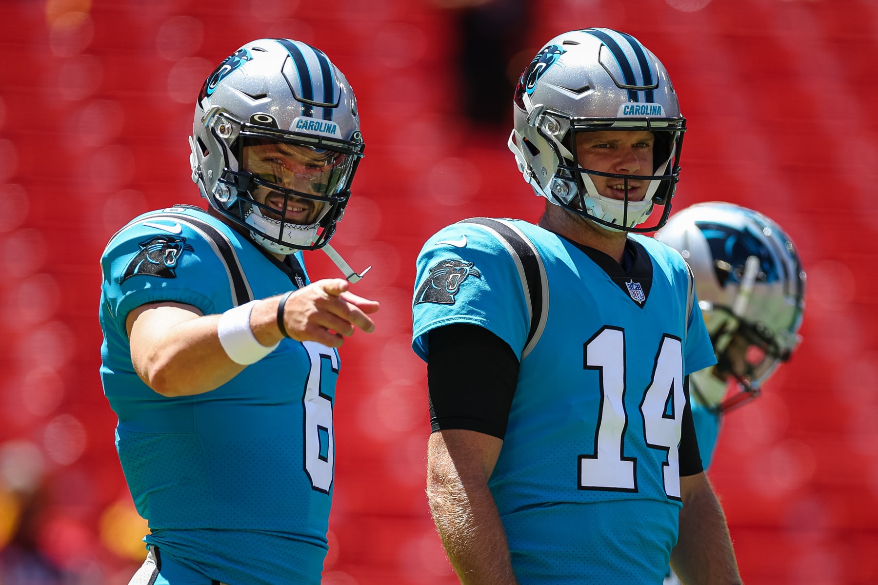 LANDOVER, MD - AUGUST 13: Baker Mayfield #6 and Sam Darnold #14 of the Carolina Panthers warmup before the preseason game against the Washington Commanders at FedExField on August 13, 2022 in Landover, Maryland. (Photo by Scott Taetsch/Getty Images)