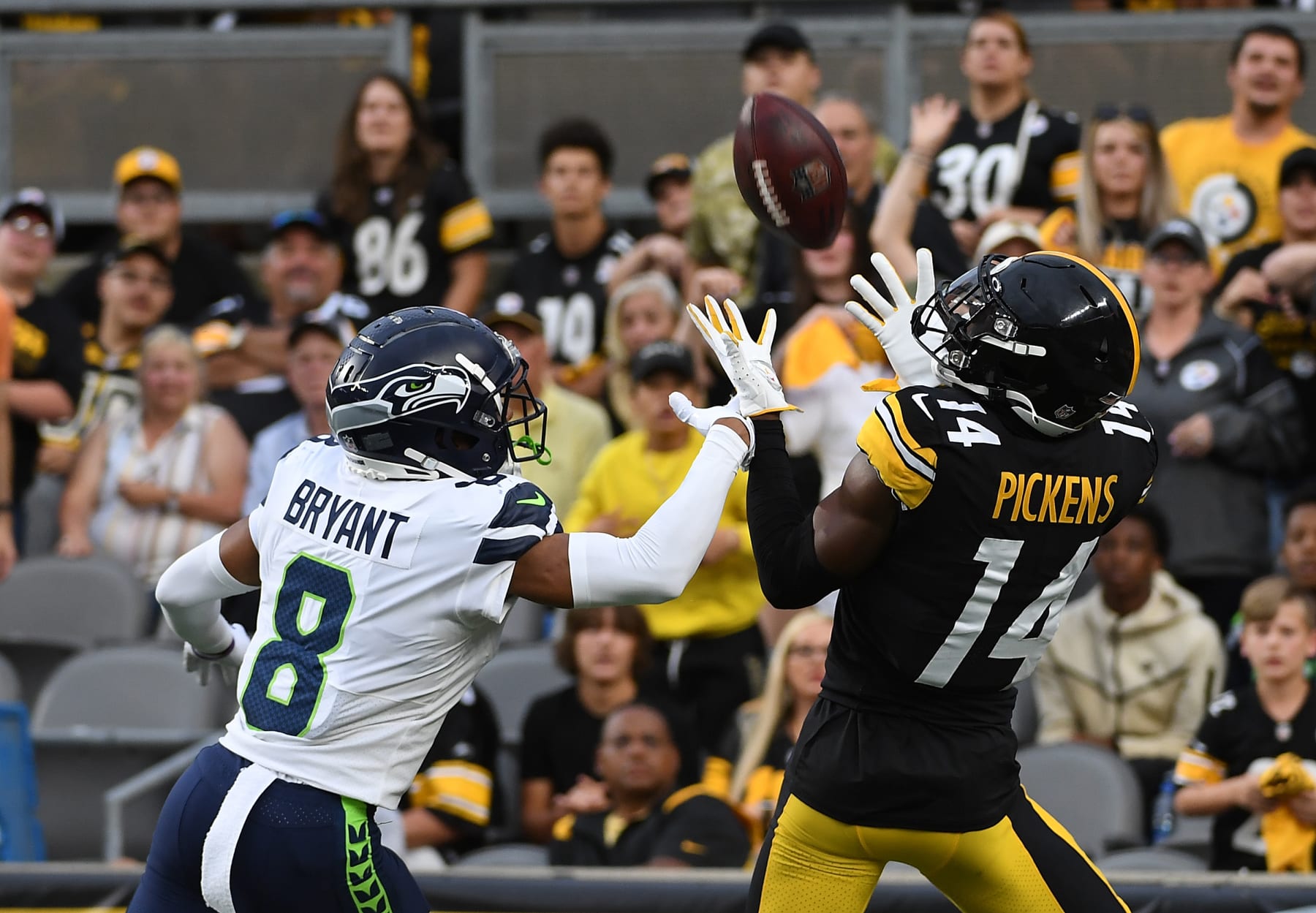 PITTSBURGH, PA - AUGUST 13: George Pickens #14 of the Pittsburgh Steelers makes a catch for a 26-yard touchdown reception as Coby Bryant #8 of the Seattle Seahawks defends in the first quarter during a preseason game at Acrisure Stadium on August 13, 2022 in Pittsburgh, Pennsylvania. (Photo by Justin Berl/Getty Images) PITTSBURGH, PA - AUGUST 13: George Pickens #14 of the Pittsburgh Steelers makes a catch for a 26-yard touchdown reception as Coby Bryant #8 of the Seattle Seahawks defends in the first quarter during a preseason game at Acrisure Stadium on August 13, 2022 in Pittsburgh, Pennsylvania. (Photo by Justin Berl/Getty Images)