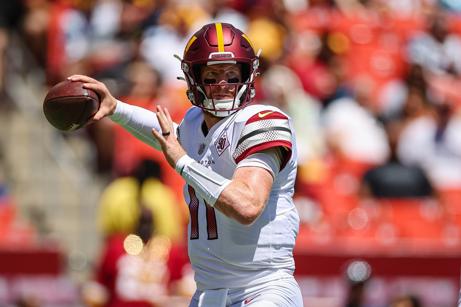 LANDOVER, MD - AUGUST 13: Carson Wentz #11 of the Washington Commanders looks to pass against the Carolina Panthers during the first half of the preseason game at FedExField on August 13, 2022 in Landover, Maryland. (Photo by Scott Taetsch/Getty Images)