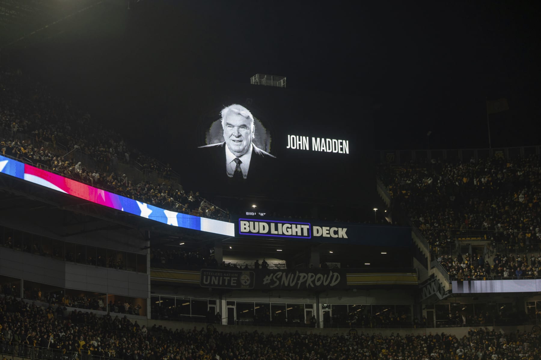 A scoreboard is shown during a moment of silence in remembrance of John Madden during an NFL football game, Monday, January 3, 2022 in Pittsburgh. (AP Photo/Matt Durisko)