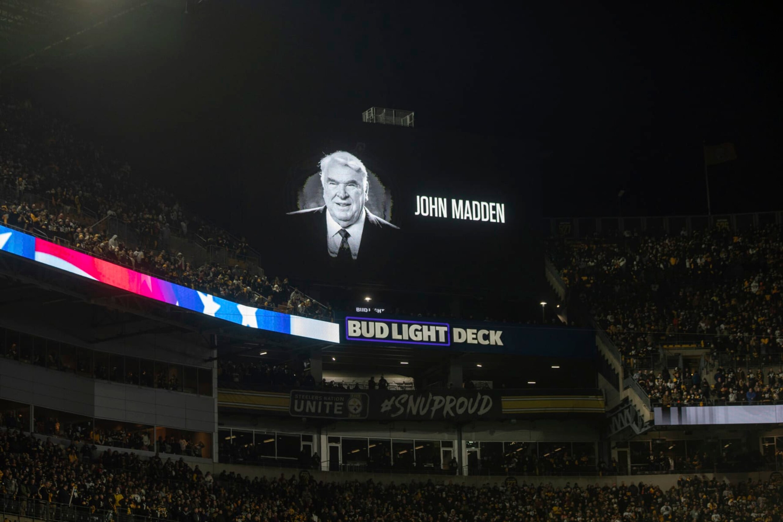 A scoreboard is shown during a moment of silence in remembrance of John Madden during an NFL football game, Monday, January 3, 2022 in Pittsburgh. (AP Photo/Matt Durisko)