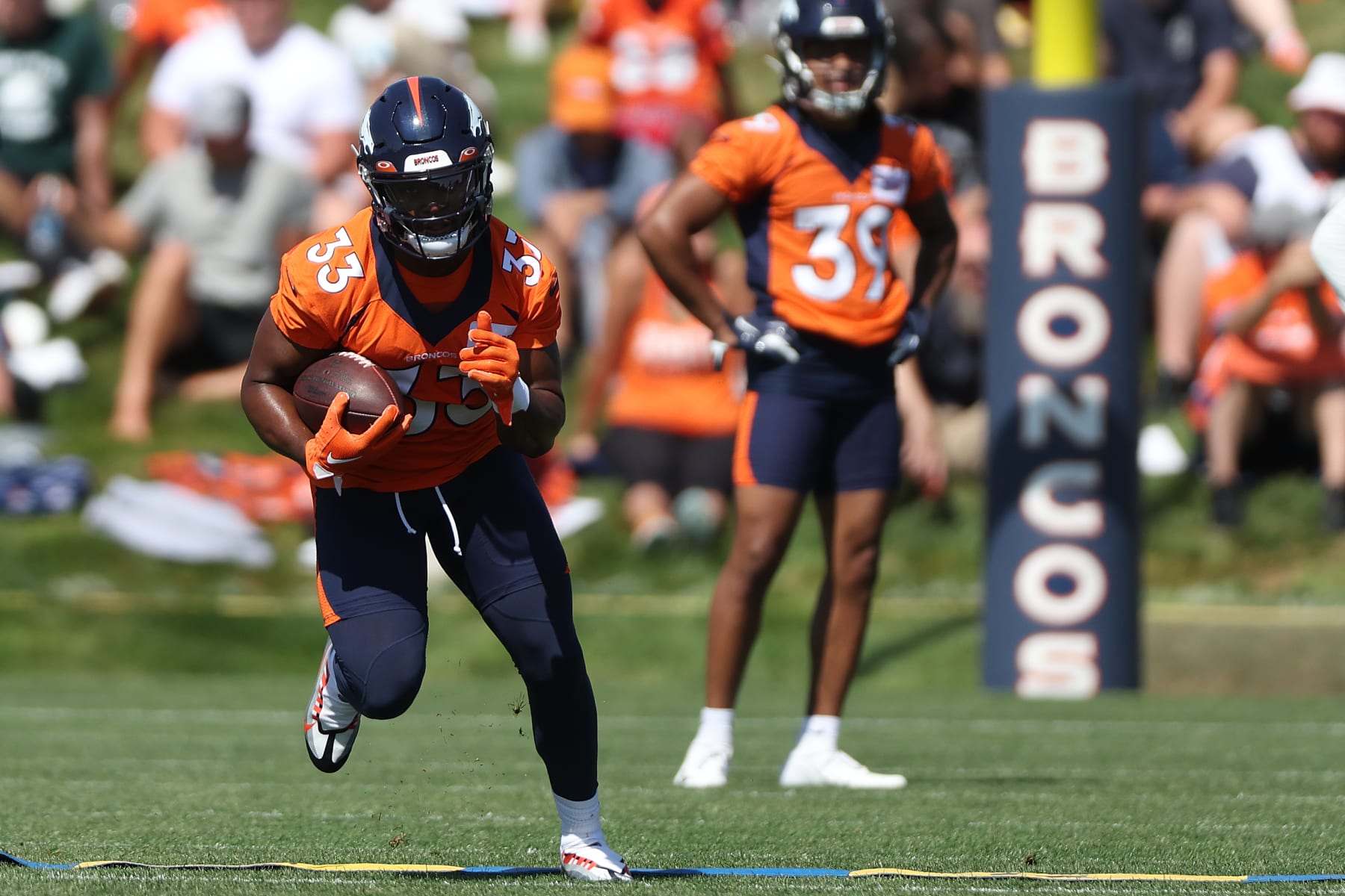 ENGLEWOOD, COLORADO - JULY 27: Javonte Williams #33 of the Denver Broncos practices with his team during training camp at UCHealth Training Center on July 27, 2022 in Englewood, Colorado. (Photo by Matthew Stockman/Getty Images)