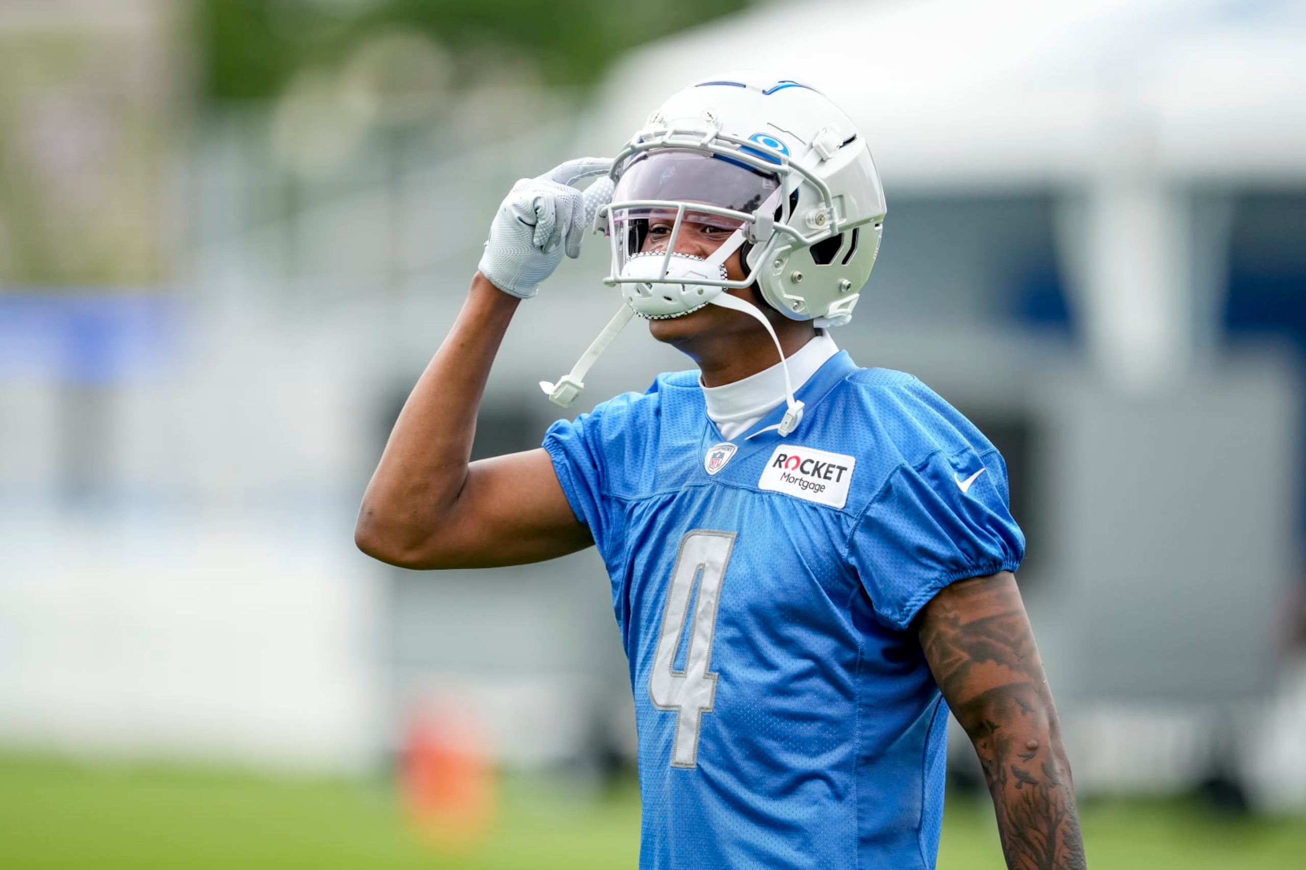 ALLEN PARK, MICHIGAN - JULY 27: DJ Chark #4 of the Detroit Lions reacts during the Detroit Lions Training Camp on July 27, 2022 in Allen Park, Michigan. (Photo by Nic Antaya/Getty Images)