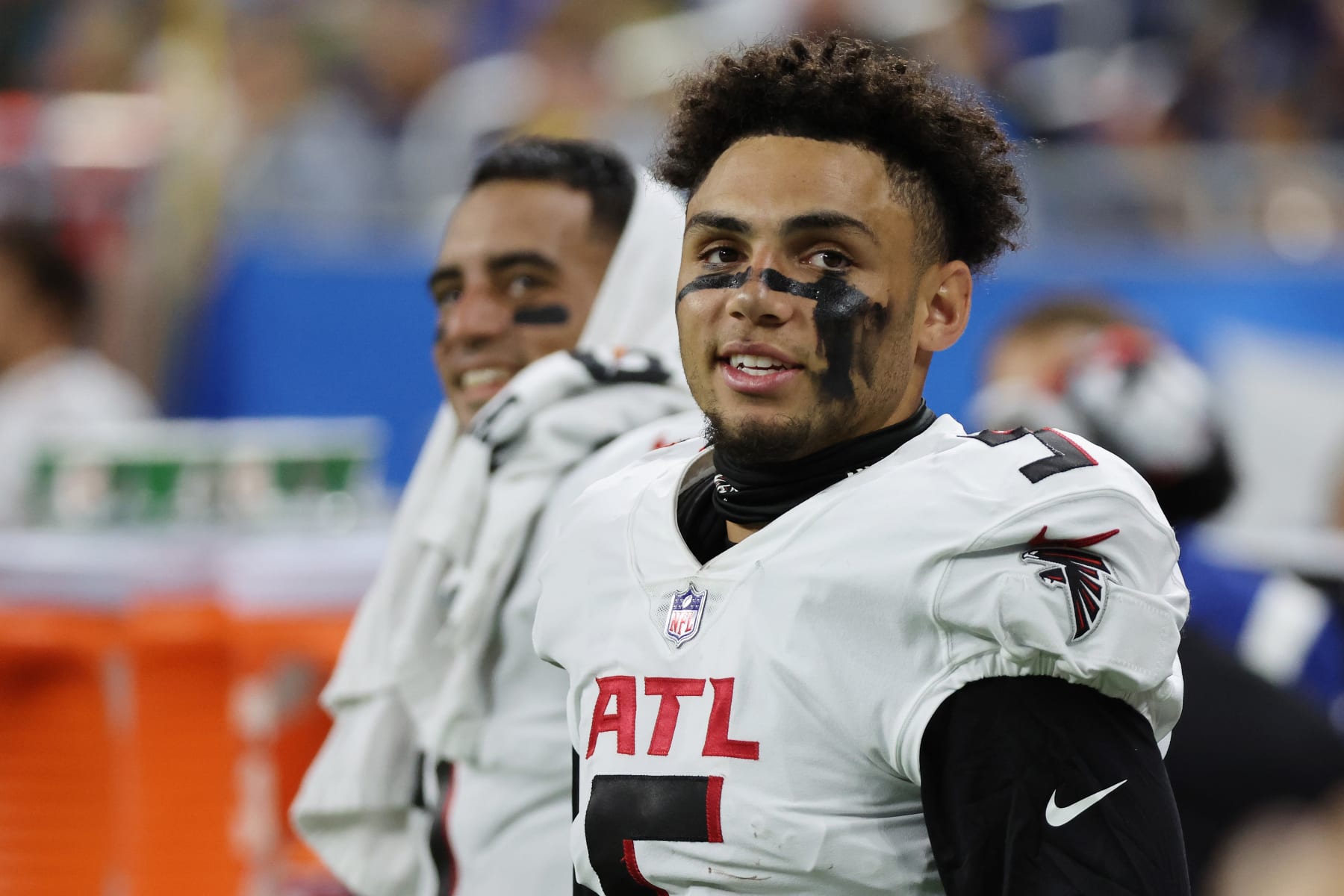 DETROIT, MICHIGAN - AUGUST 12: Drake London #5 of the Atlanta Falcons looks on from the sideline next to Marcus Mariota #1 of the Atlanta Falcons while playing the Detroit Lions during a NFL preseason game at Ford Field on August 12, 2022 in Detroit, Michigan. (Photo by Gregory Shamus/Getty Images)