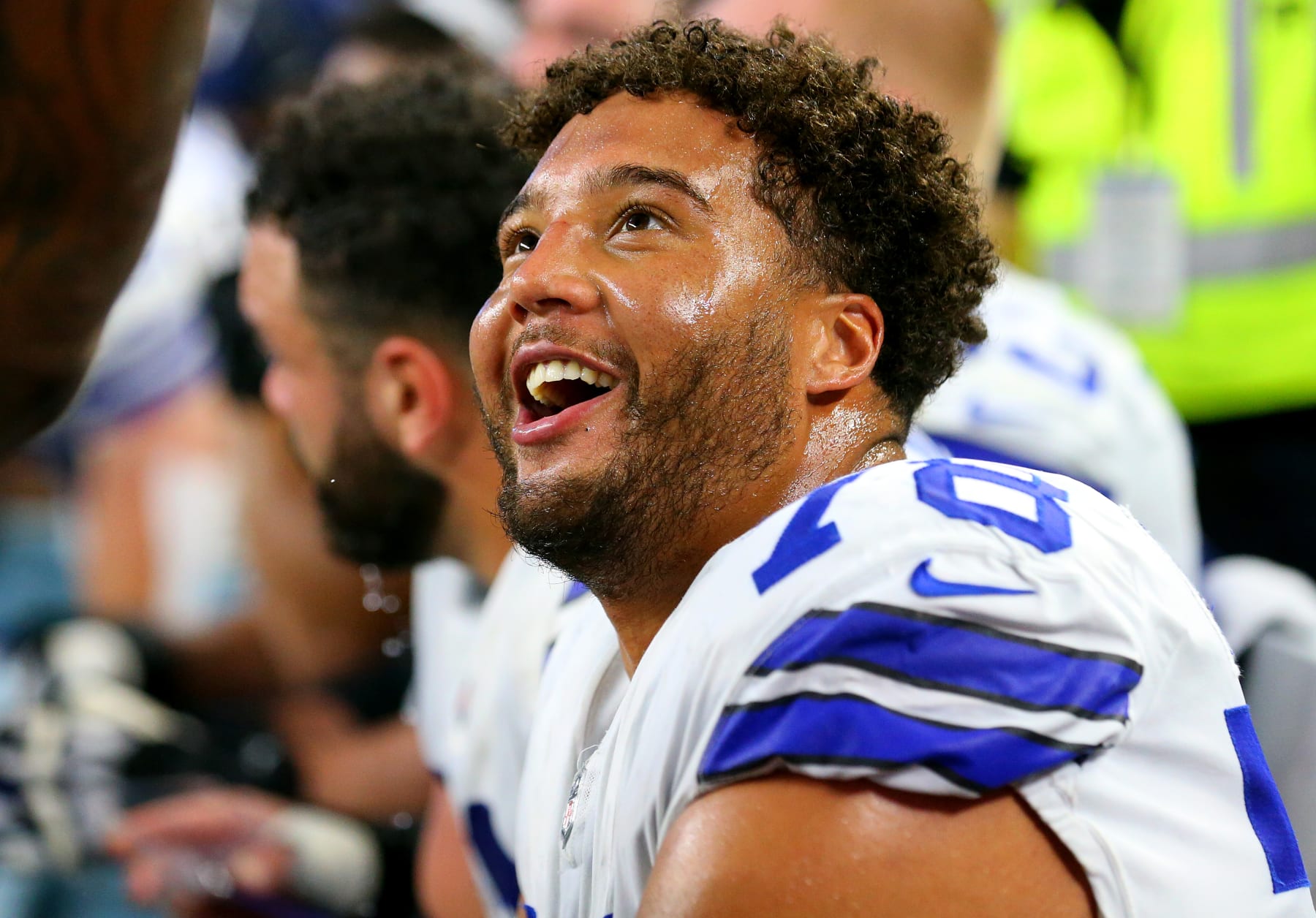 ARLINGTON, TEXAS - DECEMBER 26: Terence Steele #78 of the Dallas Cowboys smiles on the bench after scoring a touchdown during the second quarter against the Washington Football Team at AT&T Stadium on December 26, 2021 in Arlington, Texas. (Photo by Richard Rodriguez/Getty Images)