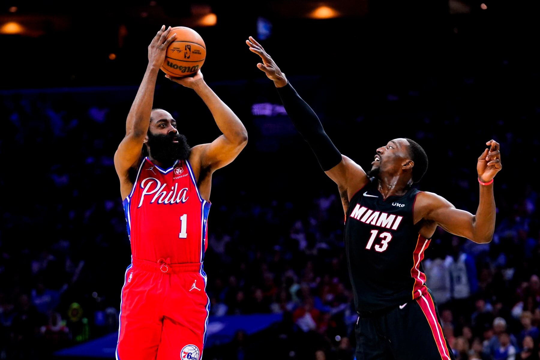 Philadelphia 76ers' James Harden (1) goes up for a shot against Miami Heat's Bam Adebayo during the second half of Game 4 of an NBA basketball second-round playoff series, Sunday, May 8, 2022, in Philadelphia. (AP Photo/Matt Slocum)