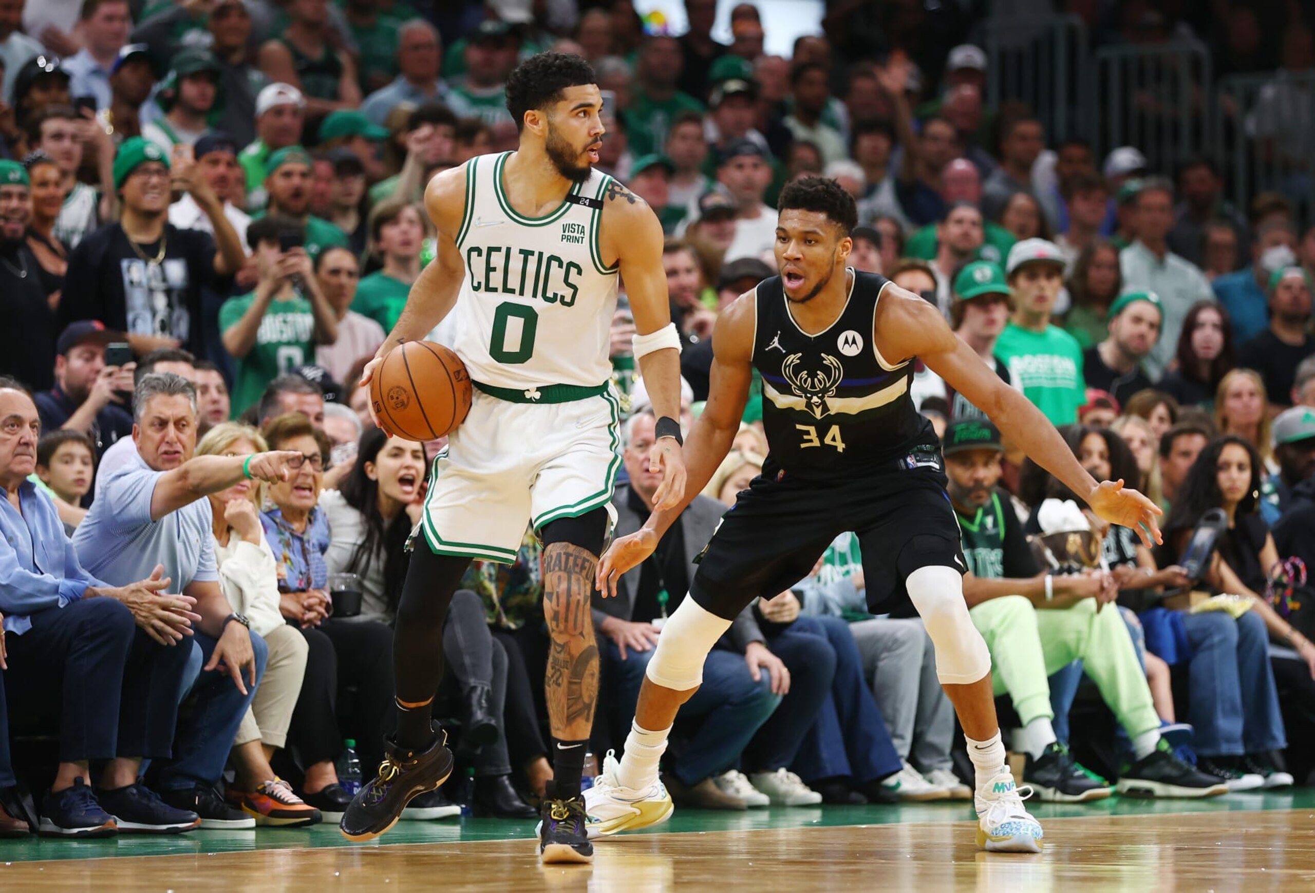 BOSTON, MASSACHUSETTS - MAY 15: Jayson Tatum #0 of the Boston Celtics handles the ball against Giannis Antetokounmpo #34 of the Milwaukee Bucks during the fourth quarter in Game Seven of the 2022 NBA Playoffs Eastern Conference Semifinals at TD Garden on May 15, 2022 in Boston, Massachusetts. NOTE TO USER: User expressly acknowledges and agrees that, by downloading and/or using this photograph, User is consenting to the terms and conditions of the Getty Images License Agreement. (Photo by Adam Glanzman/Getty Images)