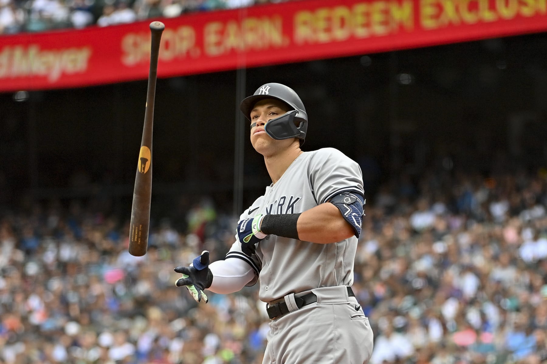 SEATTLE, WASHINGTON - AUGUST 10: Aaron Judge #99 of the New York Yankees tosses his bat before walking to first base during the third inning against the Seattle Mariners at T-Mobile Park on August 10, 2022 in Seattle, Washington. (Photo by Alika Jenner/Getty Images)
