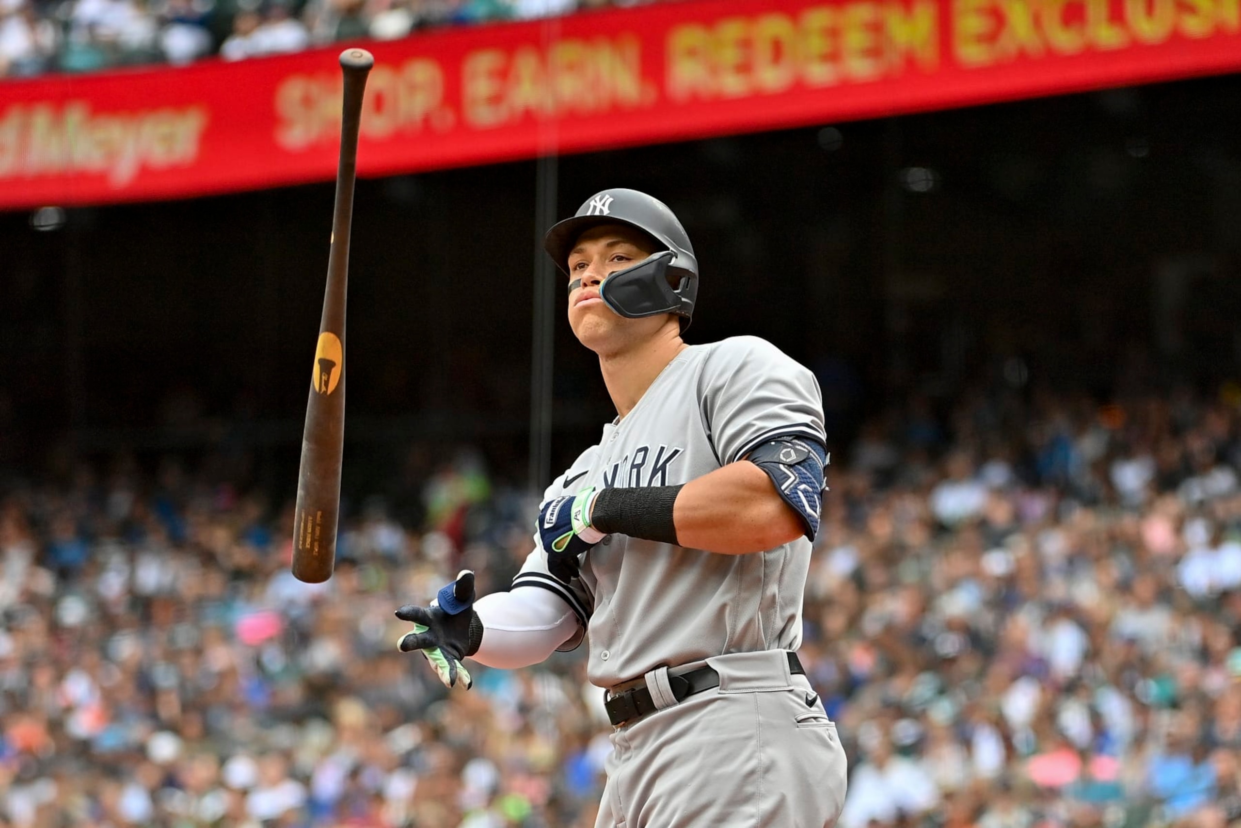 SEATTLE, WASHINGTON - AUGUST 10: Aaron Judge #99 of the New York Yankees tosses his bat before walking to first base during the third inning against the Seattle Mariners at T-Mobile Park on August 10, 2022 in Seattle, Washington. (Photo by Alika Jenner/Getty Images)