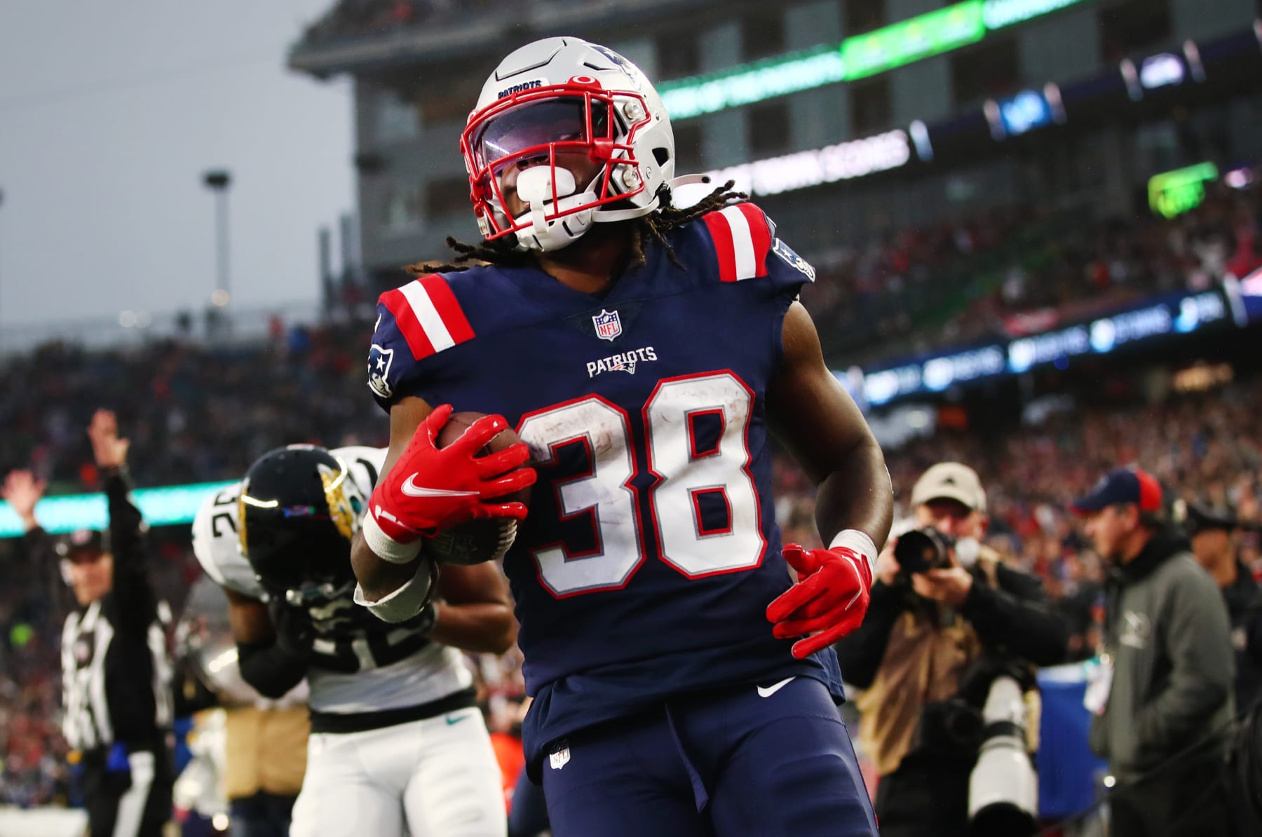 FOXBOROUGH, MASSACHUSETTS - JANUARY 02: Rhamondre Stevenson #38 of the New England Patriots scores a touchdown in the fourth quarter of the game against the Jacksonville Jaguars at Gillette Stadium on January 02, 2022 in Foxborough, Massachusetts. (Photo by Adam Glanzman/Getty Images)