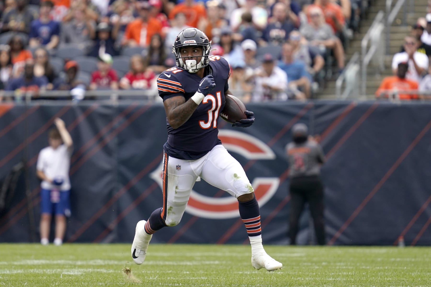 Chicago Bears running back Trestan Ebner carries the ball during the first half of an NFL preseason football game against the Kansas City Chiefs Saturday, Aug. 13, 2022, in Chicago. (AP Photo/Nam Y. Huh)