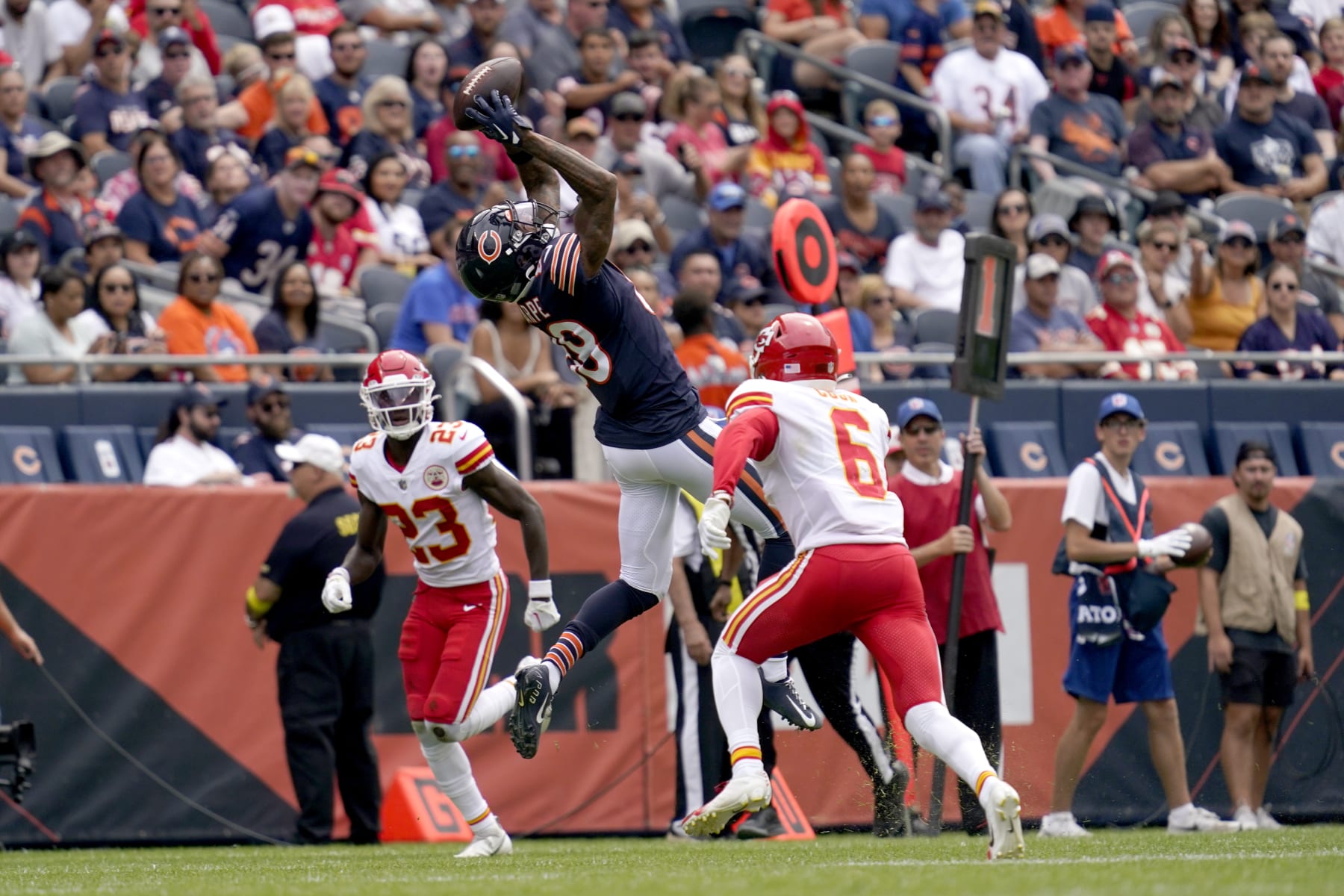 Chicago Bears wide receiver Tajae Sharpe catches a pass from quarterback Trevor Siemian as Kansas City Chiefs cornerback Joshua Williams (23) and safety Bryan Cook defend during the first half of an NFL preseason football game Saturday, Aug. 13, 2022, in Chicago. (AP Photo/Nam Y. Huh)