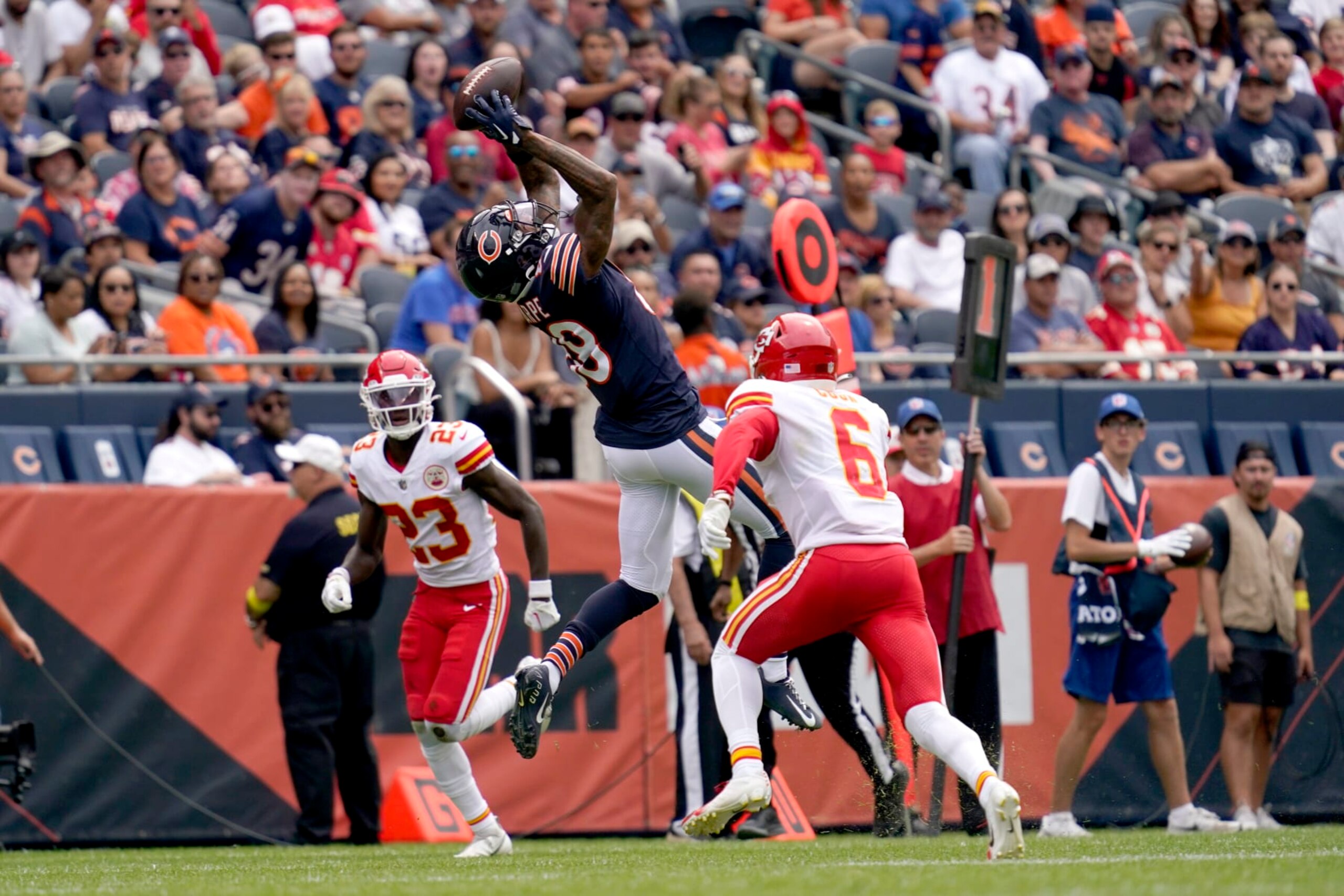 Chicago Bears wide receiver Tajae Sharpe catches a pass from quarterback Trevor Siemian as Kansas City Chiefs cornerback Joshua Williams (23) and safety Bryan Cook defend during the first half of an NFL preseason football game Saturday, Aug. 13, 2022, in Chicago. (AP Photo/Nam Y. Huh) Chicago Bears wide receiver Tajae Sharpe catches a pass from quarterback Trevor Siemian as Kansas City Chiefs cornerback Joshua Williams (23) and safety Bryan Cook defend during the first half of an NFL preseason football game Saturday, Aug. 13, 2022, in Chicago. (AP Photo/Nam Y. Huh)