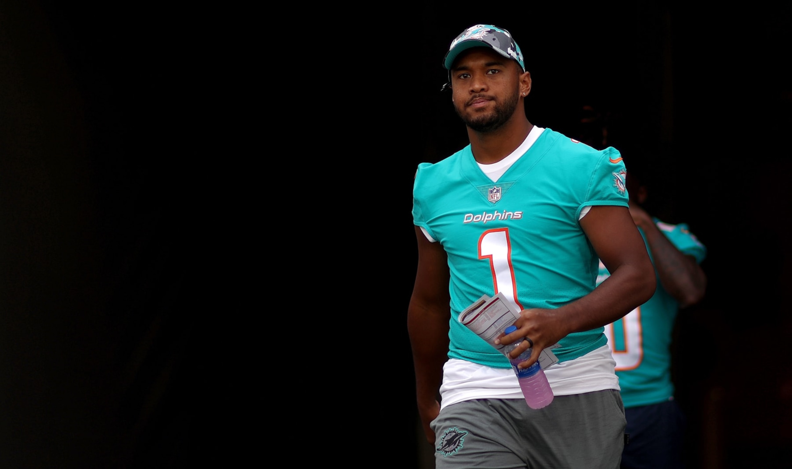 TAMPA, FLORIDA - AUGUST 13: Tua Tagovailoa #1 of the Miami Dolphins looks on  during a preseason game against the Tampa Bay Buccaneers at Raymond James Stadium on August 13, 2022 in Tampa, Florida. (Photo by Mike Ehrmann/Getty Images)