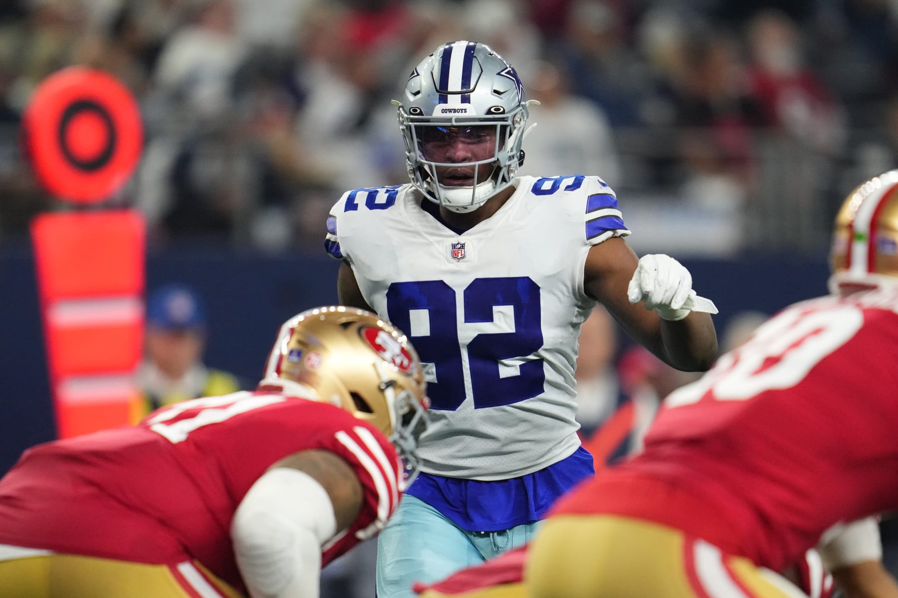 ARLINGTON, TEXAS - JANUARY 16: Dorance Armstrong #92 of the Dallas Cowboys gets set against the San Francisco 49ers during an NFL wild-card playoff football game at AT&T Stadium on January 16, 2022 in Arlington, Texas.  (Photo by Cooper Neill/Getty Images)