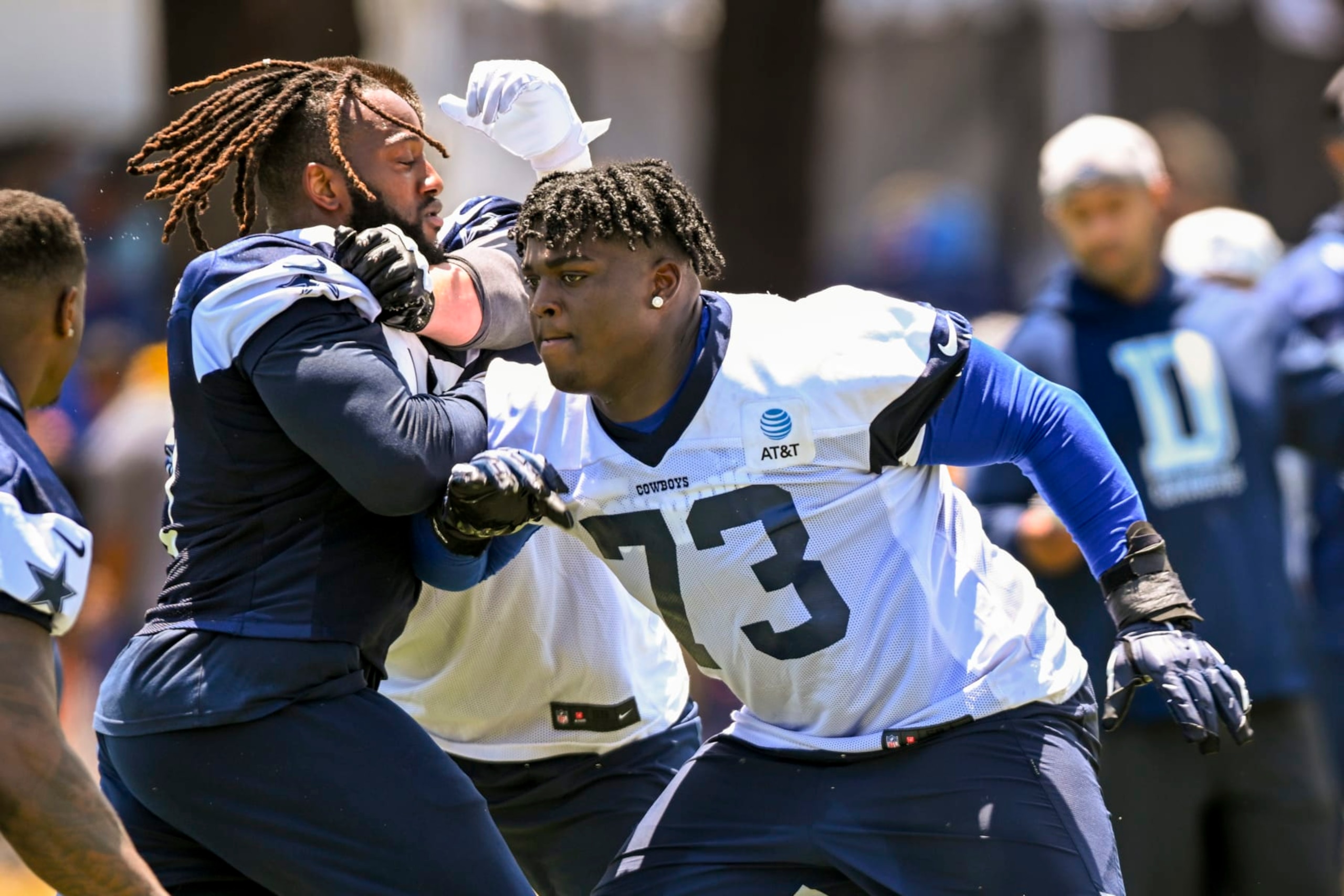 Dallas Cowboys defensive tackle Osa Odighizuwa, left, rushes against offensive tackle Tyler Smith (73) during NFL football training camp Wednesday, July 27, 2022, in Oxnard, Calif. (AP Photo/Gus Ruelas) Dallas Cowboys defensive tackle Osa Odighizuwa, left, rushes against offensive tackle Tyler Smith (73) during NFL football training camp Wednesday, July 27, 2022, in Oxnard, Calif. (AP Photo/Gus Ruelas)