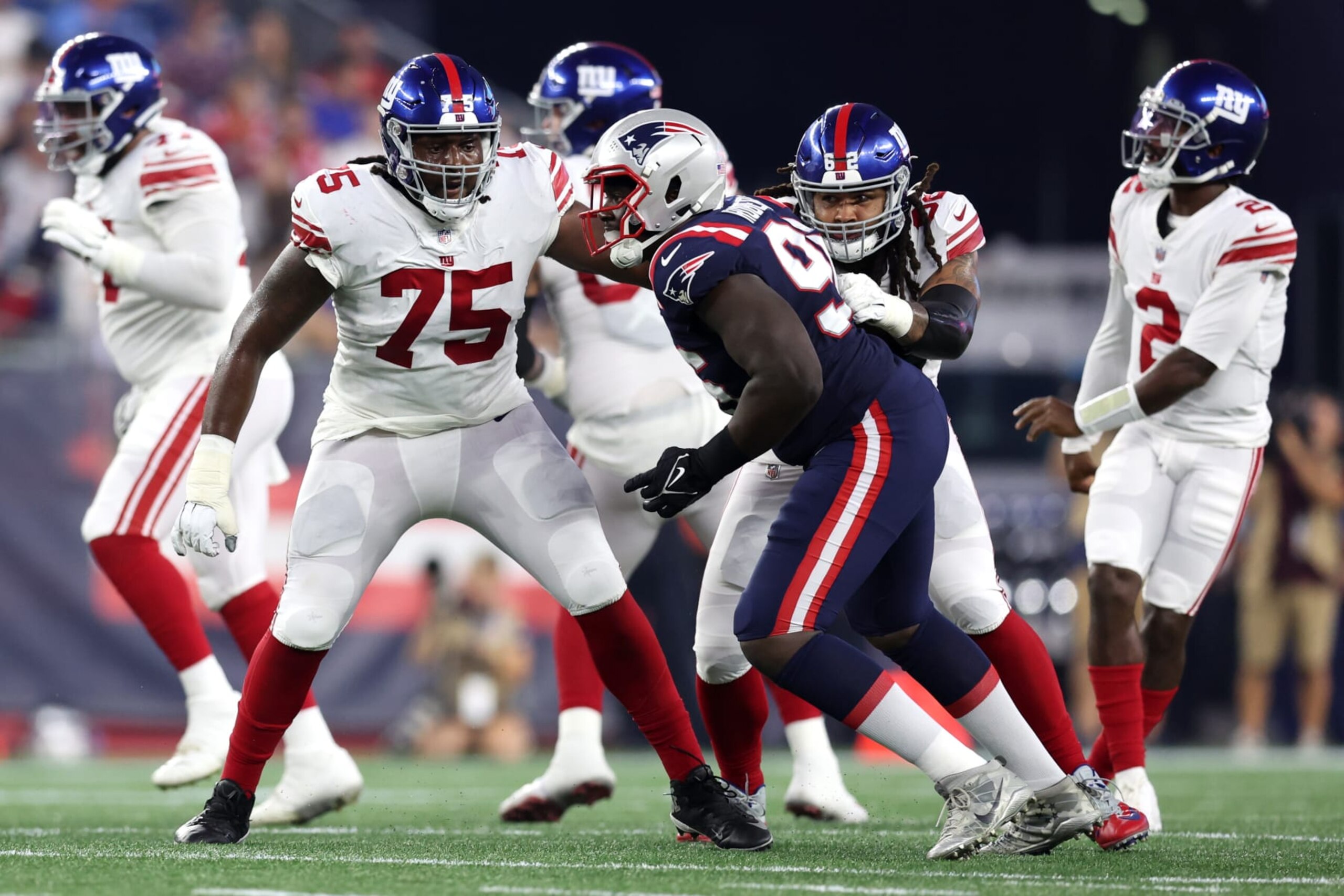 FOXBOROUGH, MASSACHUSETTS - AUGUST 11: Joshua Ezeudu #75 of the New York Giants defends Sam Roberts #96 of the New England Patriots during the preseason game between the New York Giants and the New England Patriots at Gillette Stadium on August 11, 2022 in Foxborough, Massachusetts. (Photo by Maddie Meyer/Getty Images) FOXBOROUGH, MASSACHUSETTS - AUGUST 11: Joshua Ezeudu #75 of the New York Giants defends Sam Roberts #96 of the New England Patriots during the preseason game between the New York Giants and the New England Patriots at Gillette Stadium on August 11, 2022 in Foxborough, Massachusetts. (Photo by Maddie Meyer/Getty Images)