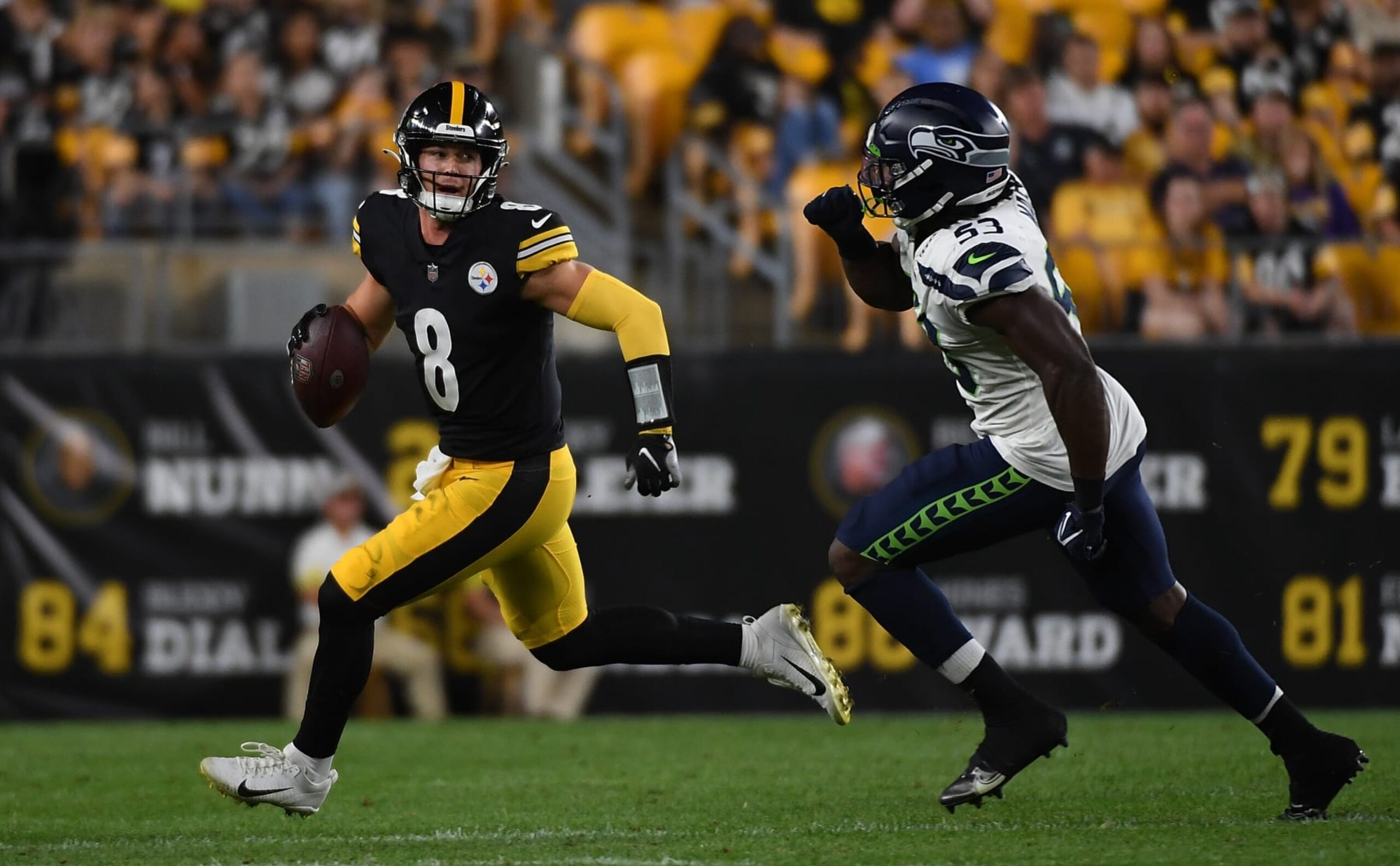 PITTSBURGH, PA - AUGUST 13: Kenny Pickett #8 of the Pittsburgh Steelers scrambles out of the pocket under pressure from Boye Mafe #53 of the Seattle Seahawks in the fourth quarter during a preseason game at Acrisure Stadium on August 13, 2022 in Pittsburgh, Pennsylvania. (Photo by Justin Berl/Getty Images) PITTSBURGH, PA - AUGUST 13: Kenny Pickett #8 of the Pittsburgh Steelers scrambles out of the pocket under pressure from Boye Mafe #53 of the Seattle Seahawks in the fourth quarter during a preseason game at Acrisure Stadium on August 13, 2022 in Pittsburgh, Pennsylvania. (Photo by Justin Berl/Getty Images)