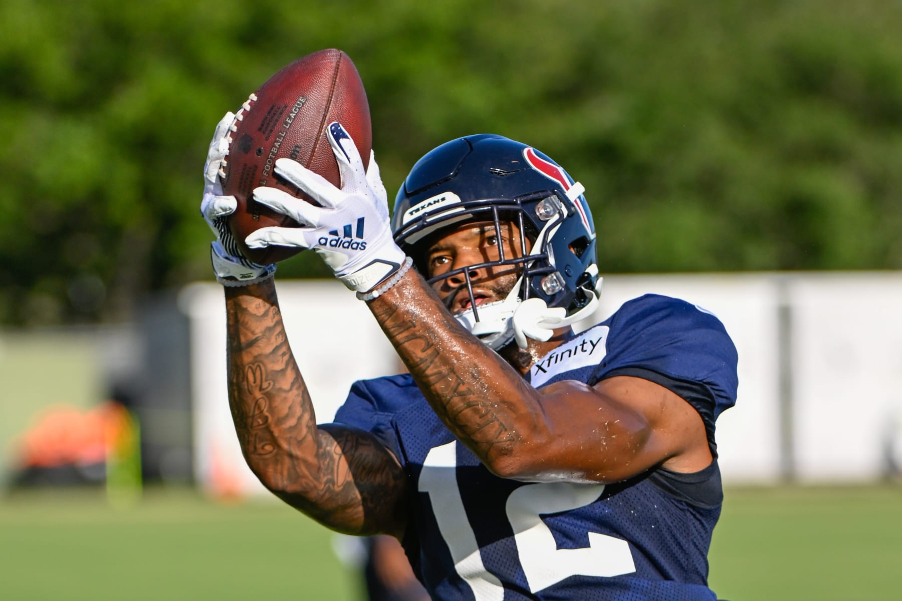 HOUSTON, TX - AUGUST 01:Houston Texans wide receiver Nico Collins (12) makes a touchdown reception during the Houston Texans Training Camp session at Houston Methodist Training Center adjacent to NRG Stadium on August 1, 2022 in Houston, Texas. (Photo by Ken Murray/Icon Sportswire via Getty Images)