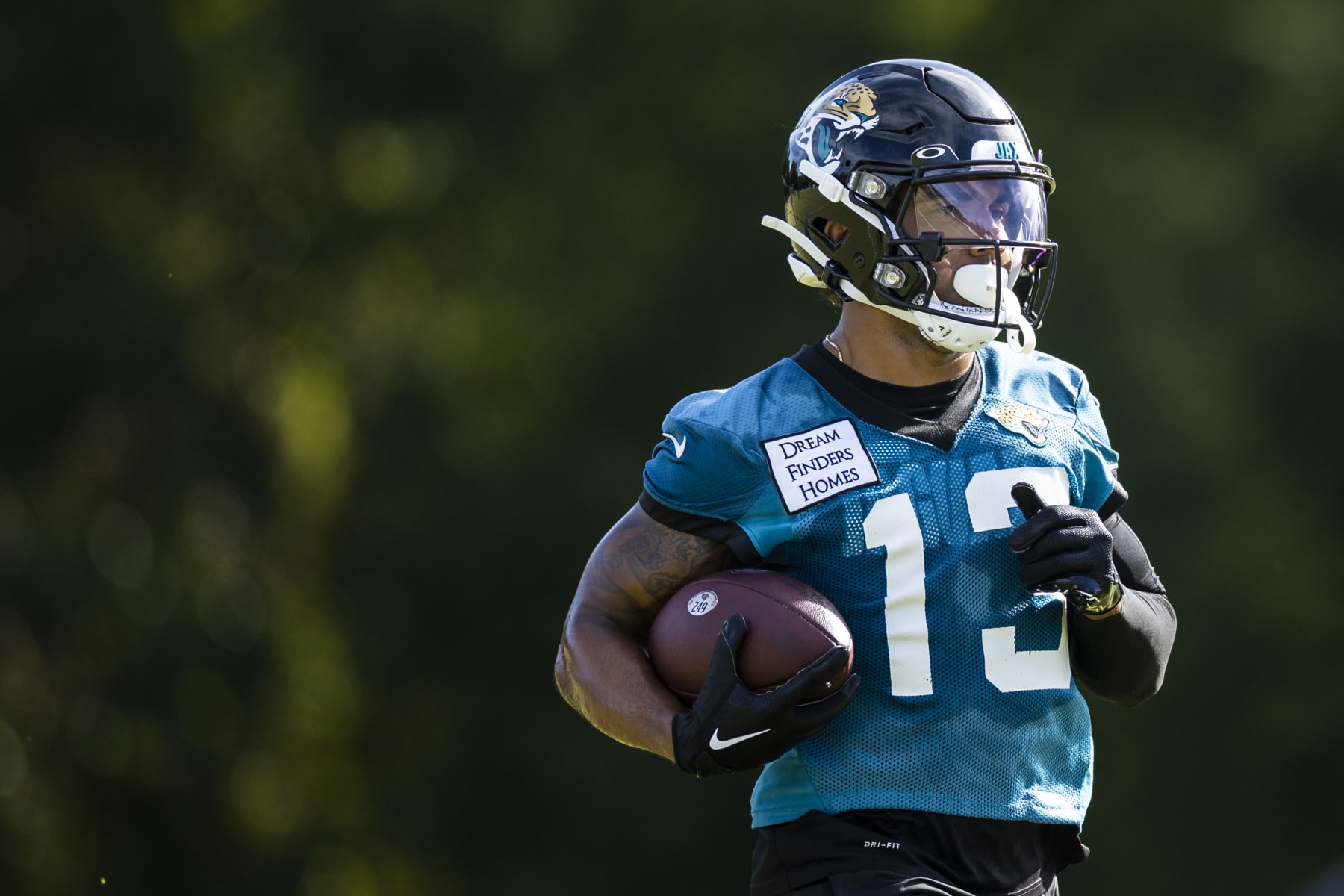 JACKSONVILLE, FLORIDA - JULY 26: Christian Kirk #13 of the Jacksonville Jaguars runs during Training camp on July 26, 2022 at Episcopal High School in Jacksonville, Florida. (Photo by James Gilbert/Getty Images)