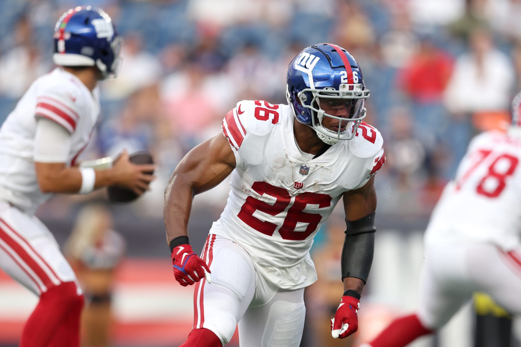 FOXBOROUGH, MASSACHUSETTS - AUGUST 11: Saquon Barkley #26 of the New York Giants looks on during the preseason game between the New York Giants and the New England Patriots at Gillette Stadium on August 11, 2022 in Foxborough, Massachusetts. (Photo by Maddie Meyer/Getty Images)