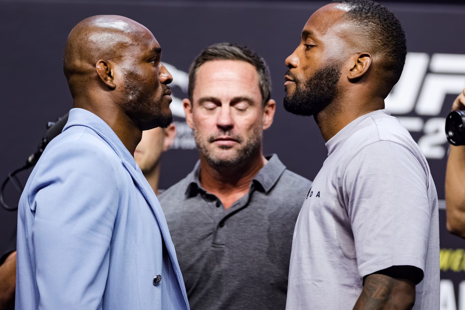LAS VEGAS, NEVADA - JULY 01: UFC welterweight champion Kamaru Usman and Leon Edwards face off on stage during the UFC 276 ceremonial weigh-in at T-Mobile Arena on July 01, 2022 in Las Vegas, Nevada. (Photo by Carmen Mandato/Getty Images)