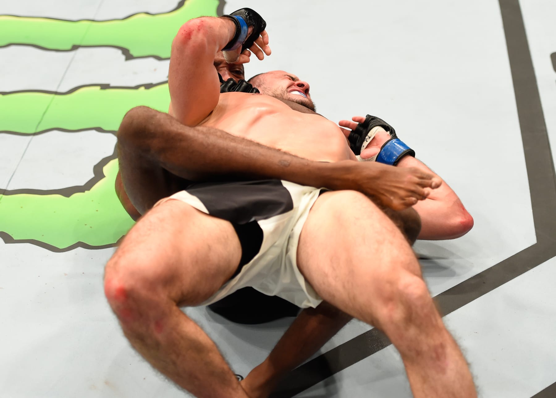 MANCHESTER, ENGLAND - OCTOBER 08:  (L-R) Leon Edwards of Jamaica submits Albert Tumenov of Russia in their welterweight bout during the UFC 204 Fight Night at the Manchester Evening News Arena on October 8, 2016 in Manchester, England. (Photo by Josh Hedges/Zuffa LLC/Zuffa LLC via Getty Images)