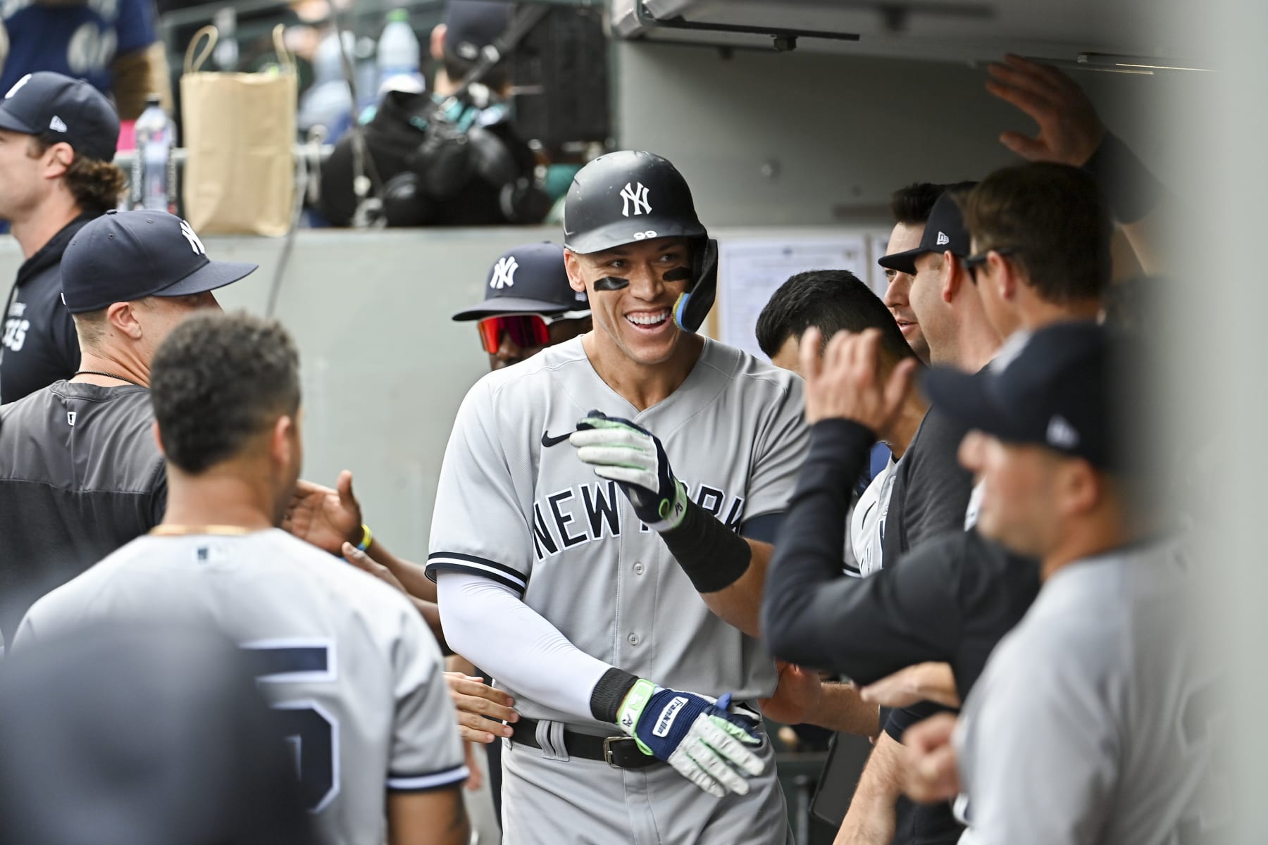 SEATTLE, WASHINGTON - AUGUST 10: Aaron Judge #99 of the New York Yankees celebrates with teammates after hitting a solo home run during the sixth inning against the Seattle Mariners at T-Mobile Park on August 10, 2022 in Seattle, Washington. (Photo by Alika Jenner/Getty Images)