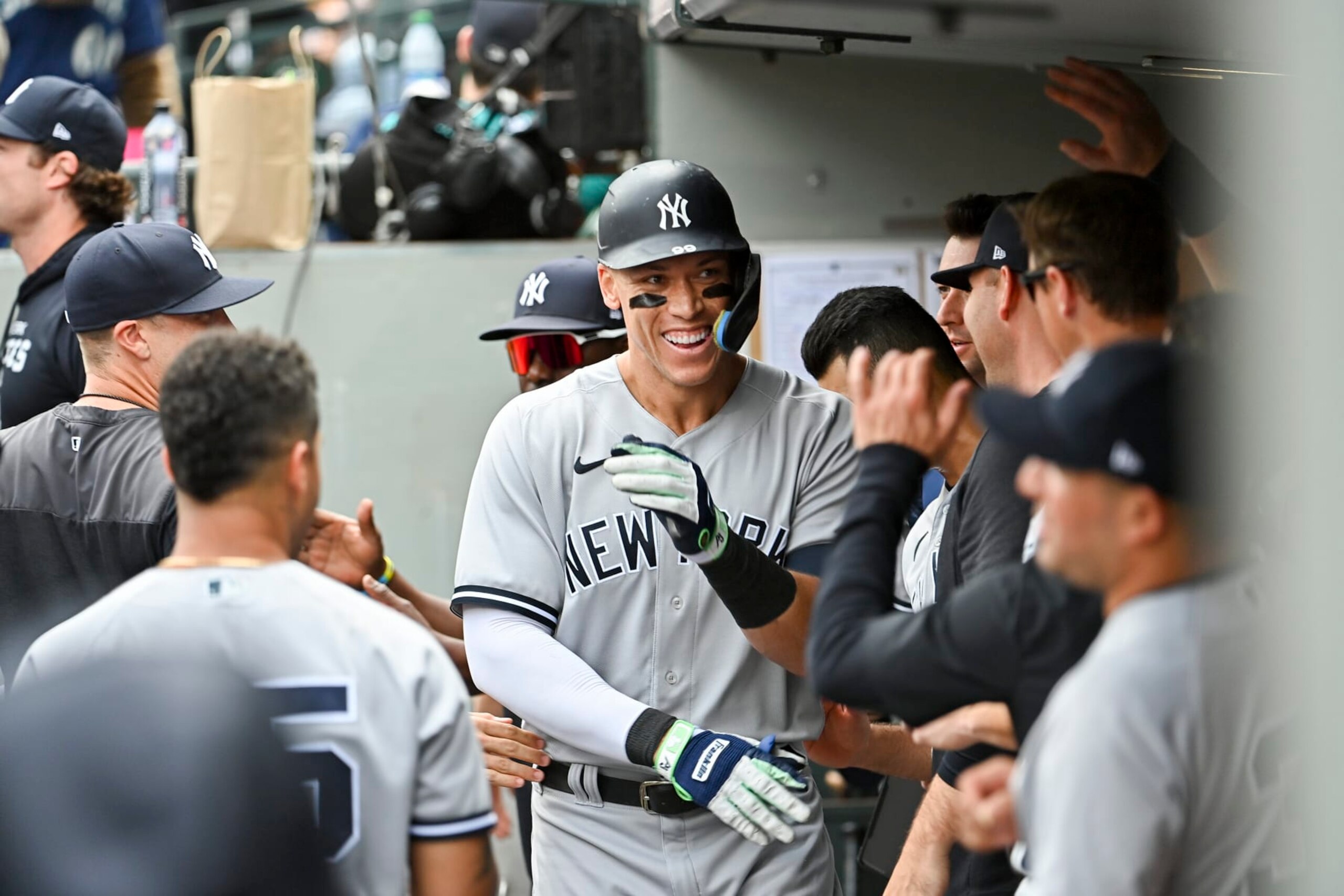 SEATTLE, WASHINGTON - AUGUST 10: Aaron Judge #99 of the New York Yankees celebrates with teammates after hitting a solo home run during the sixth inning against the Seattle Mariners at T-Mobile Park on August 10, 2022 in Seattle, Washington. (Photo by Alika Jenner/Getty Images)