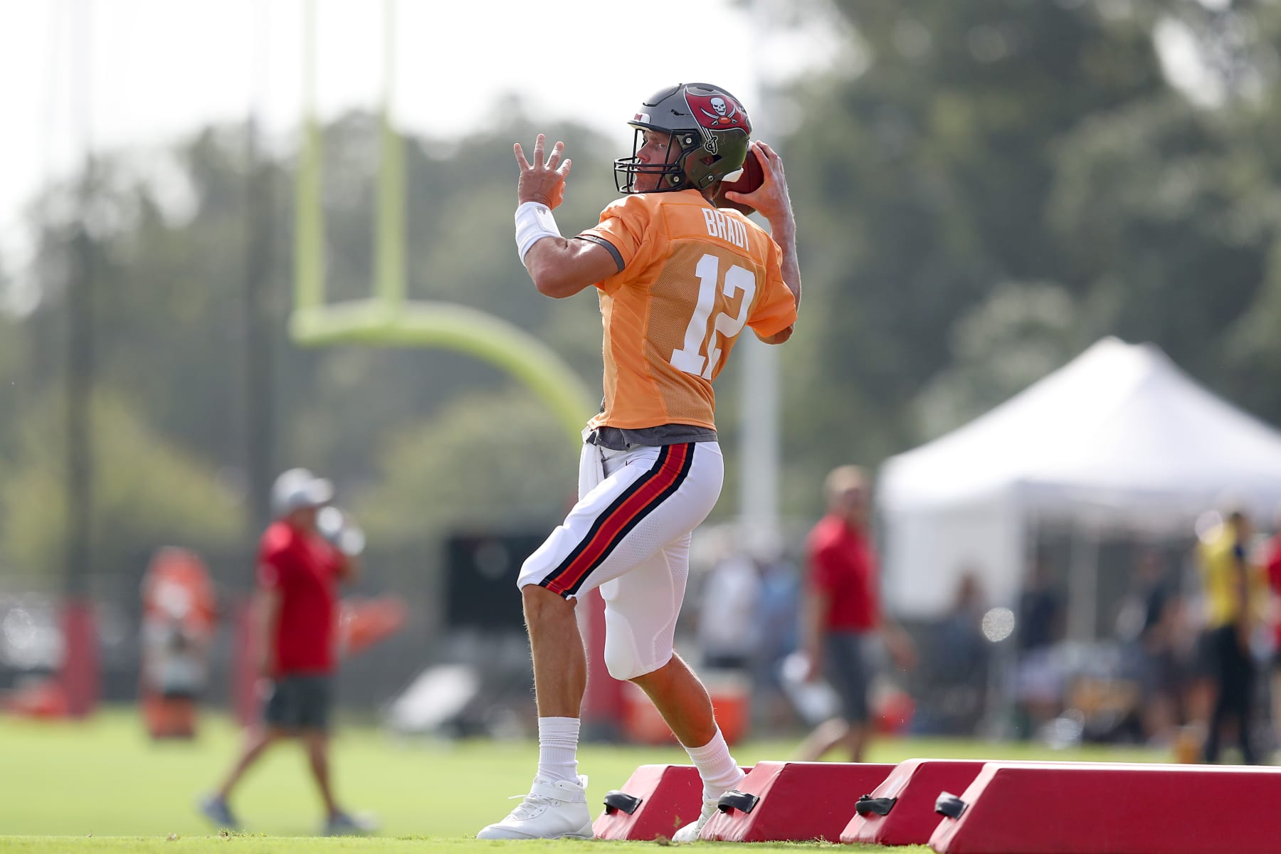 TAMPA, FL - AUG 10: Tampa Bay Buccaneers quarterback Tom Brady (12) throws a pass during the Tampa Bay Buccaneers & Miami Dolphins Joint-Practice on August 10, 2022 at the AdventHealth Training Center at One Buccaneer Place in Tampa, Florida. (Photo by Cliff Welch/Icon Sportswire via Getty Images)