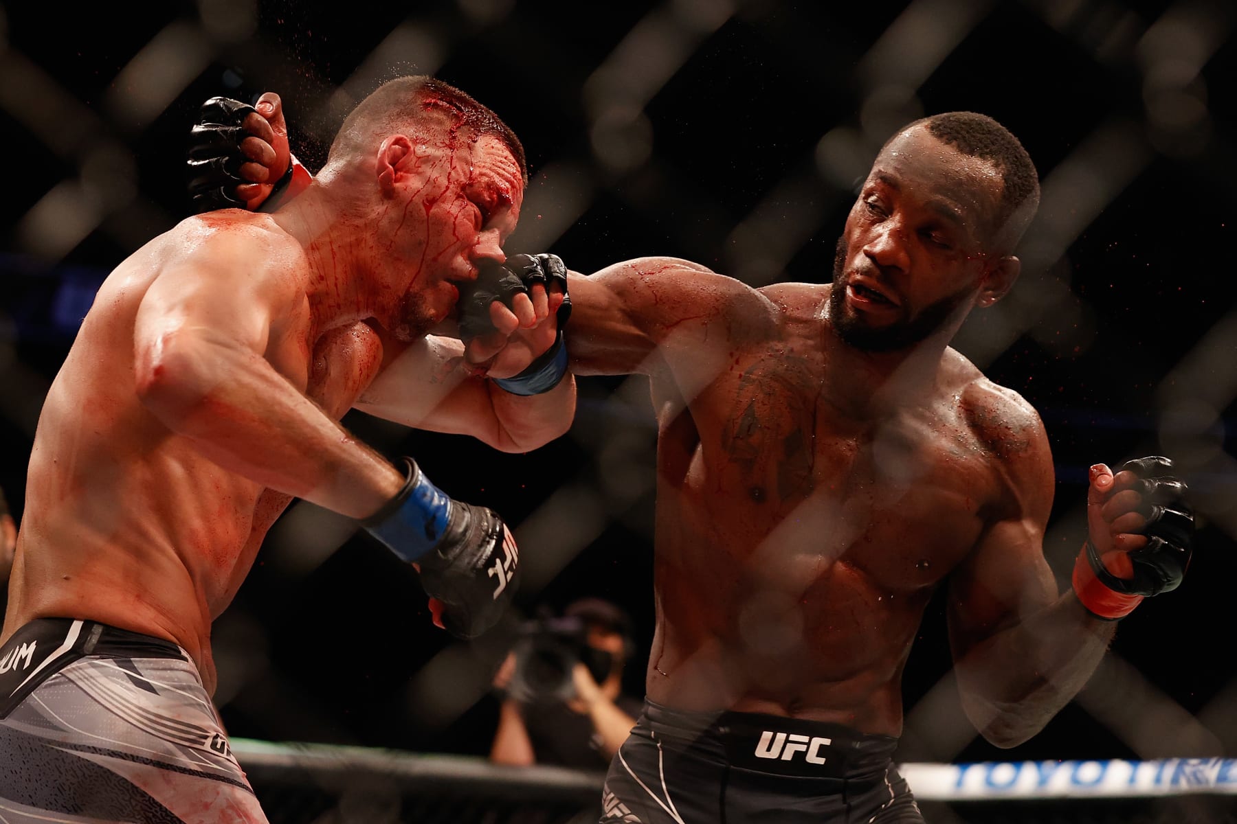 GLENDALE, ARIZONA - JUNE 12: Leon Edwards (R) of Jamaica throws a right on Nate Diaz during their UFC 263 welterweight match at Gila River Arena on June 12, 2021 in Glendale, Arizona.